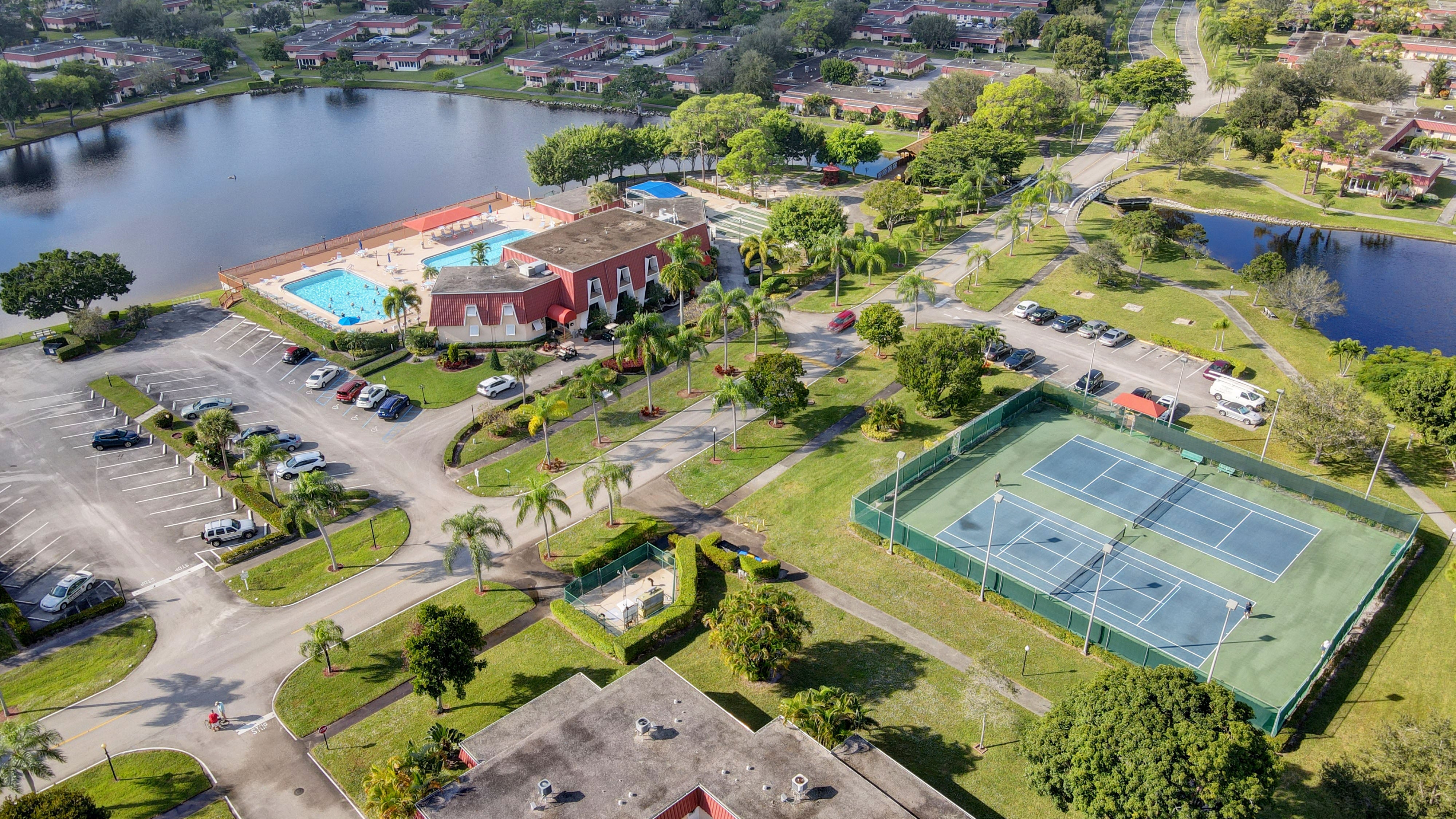 Aerial view of Covered Bridge amenities, lakes, pools, and tennis courts