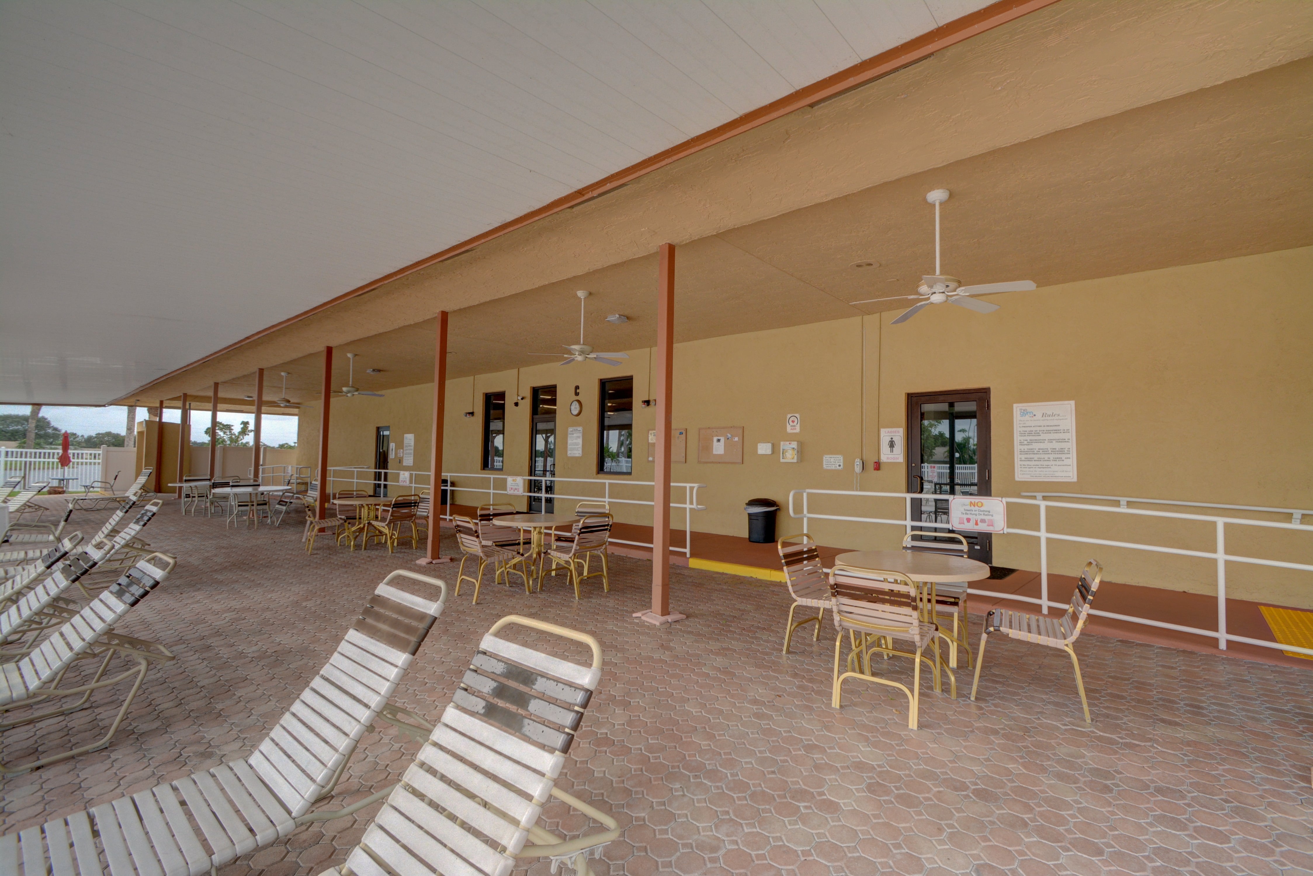 Covered pool patio at Delray Villas
