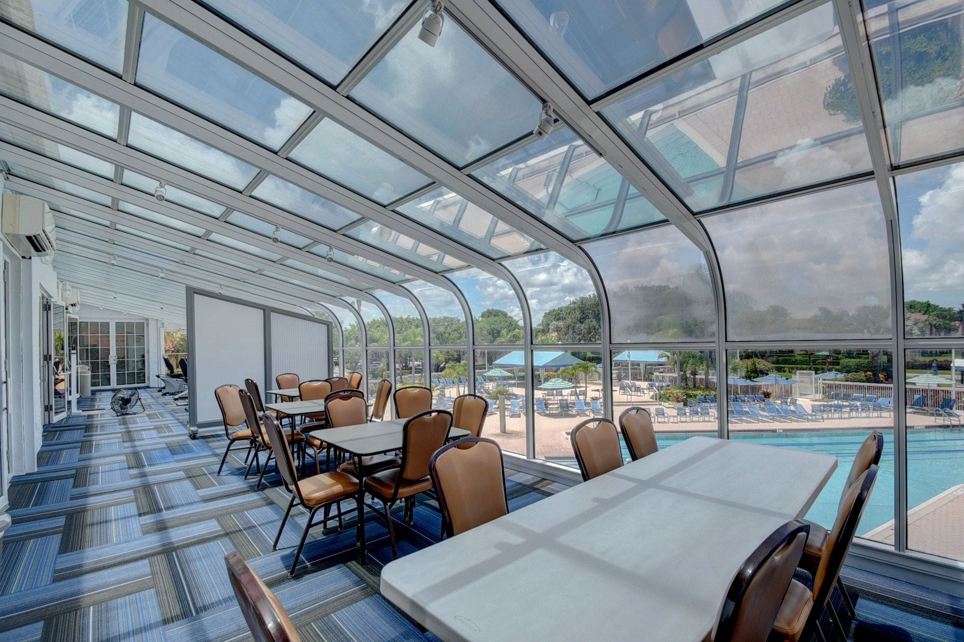 Fitness center with pool views at Platina