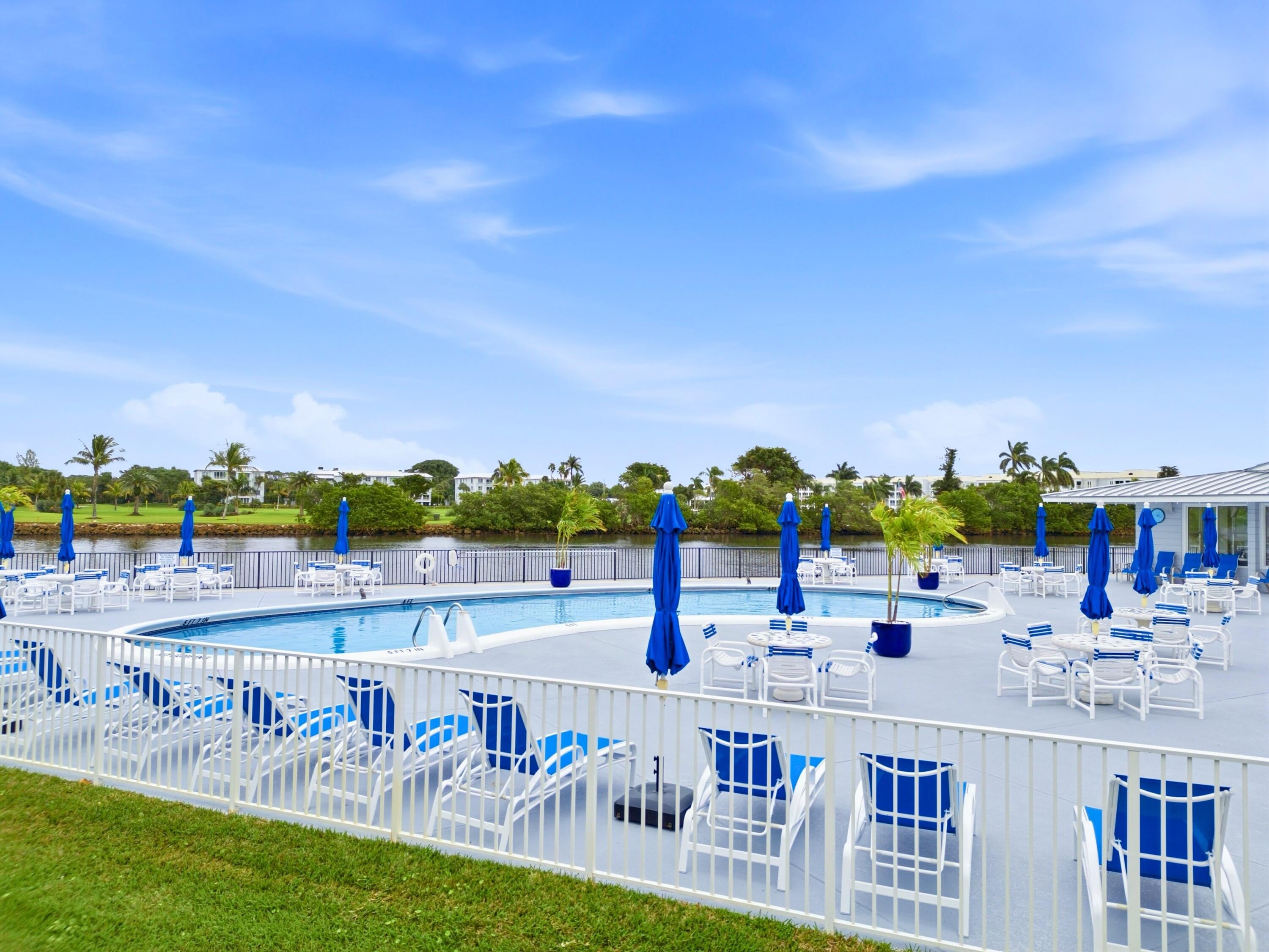 Pool deck and waterfront view at Hampshire Gardens in Boynton Beach