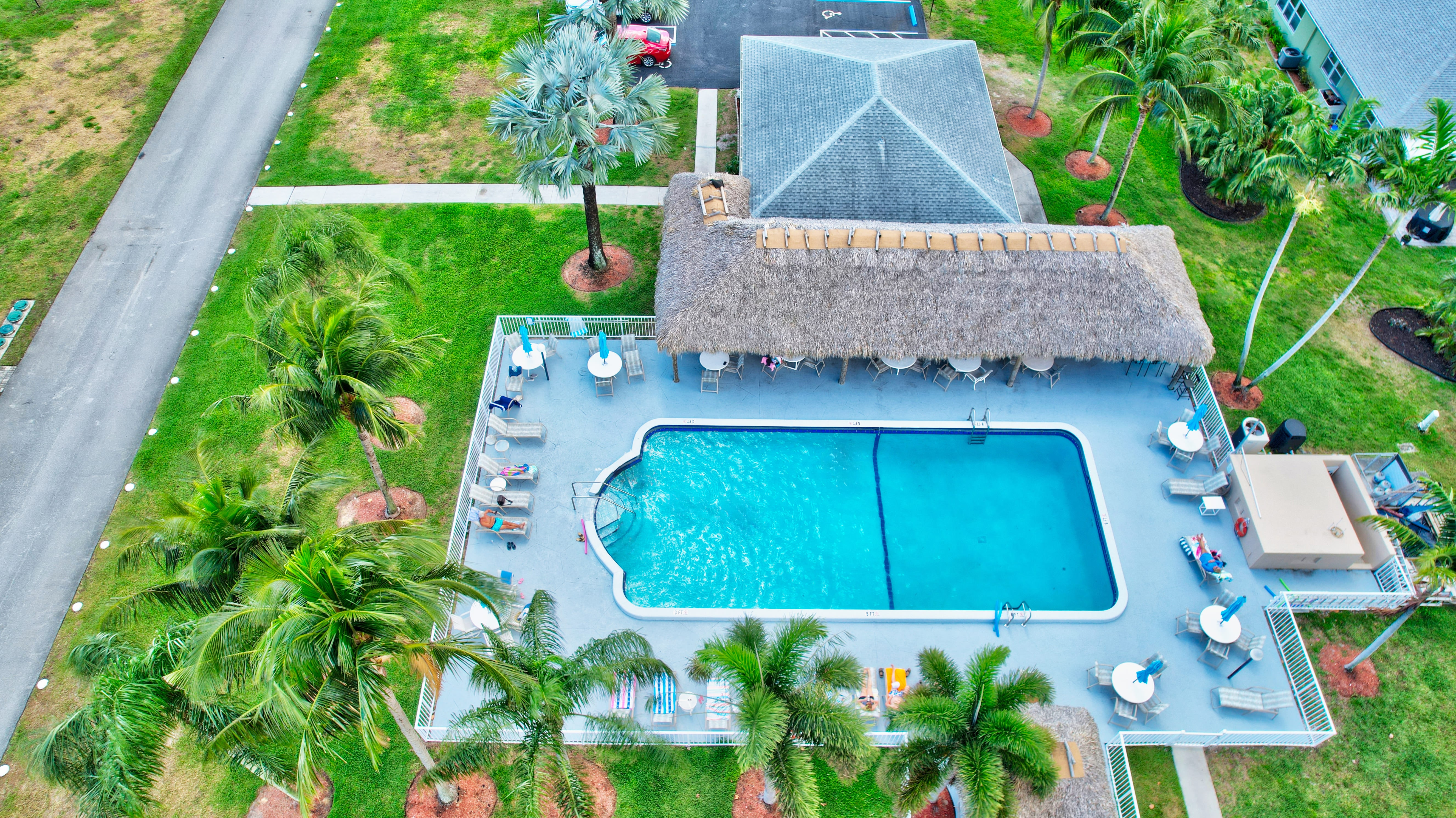 Aerial view of the High Point of Boynton Beach clubhouse, pool, and courts