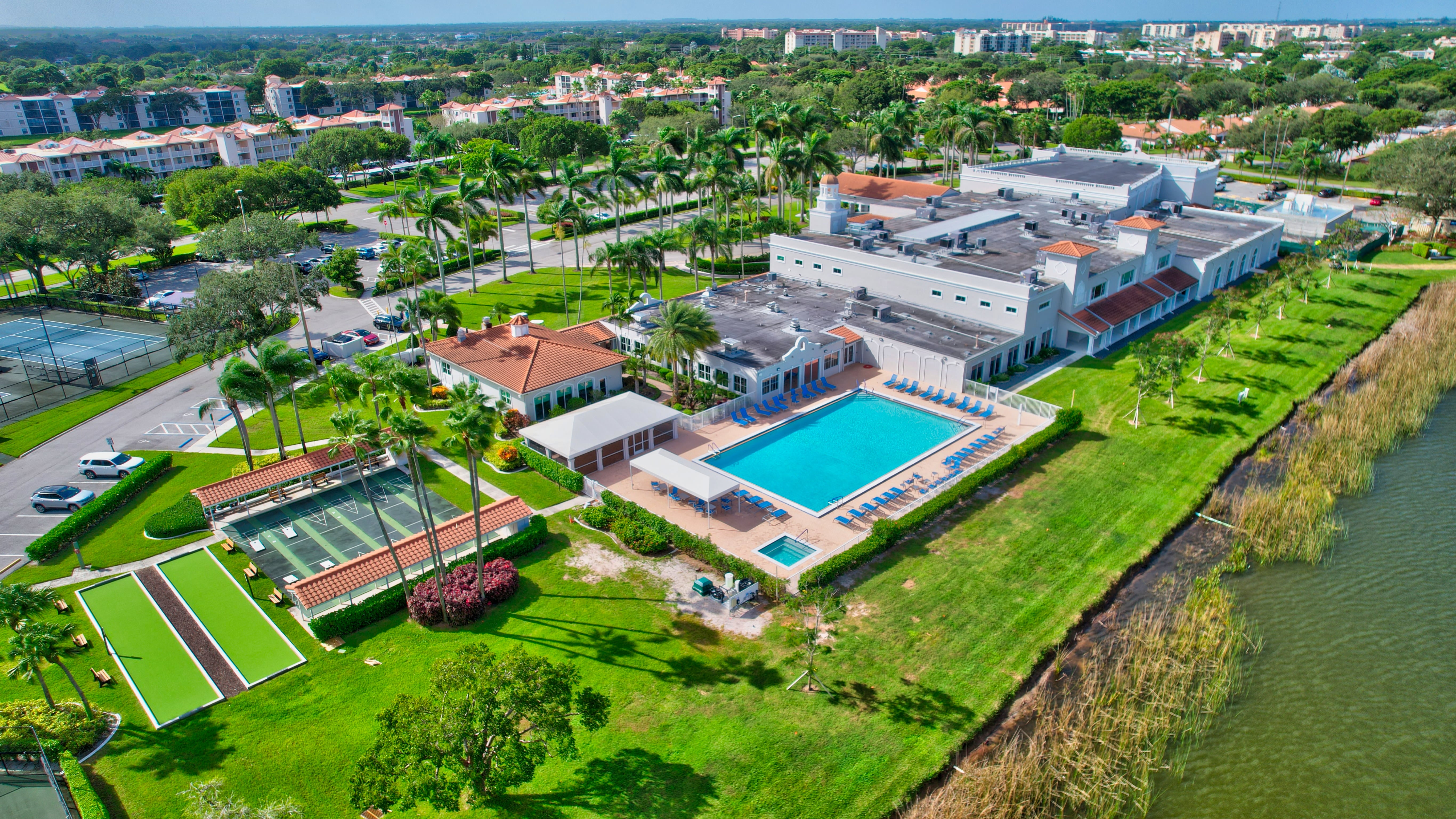 Aerial view of the Huntington Pointe clubhouse, pool, and courts