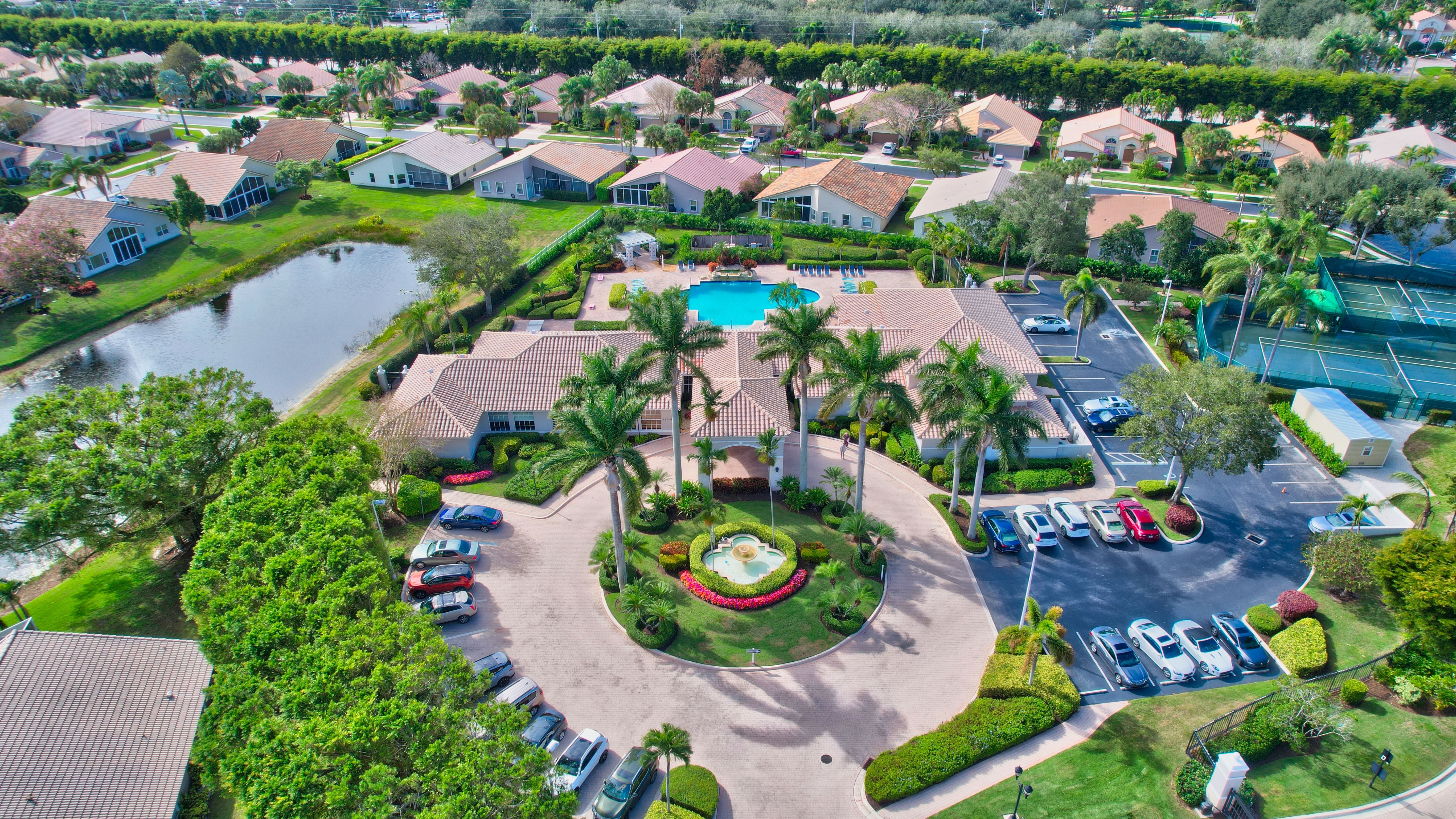 Aerial view of homes, lakes, and green space in a South Florida active-adult community