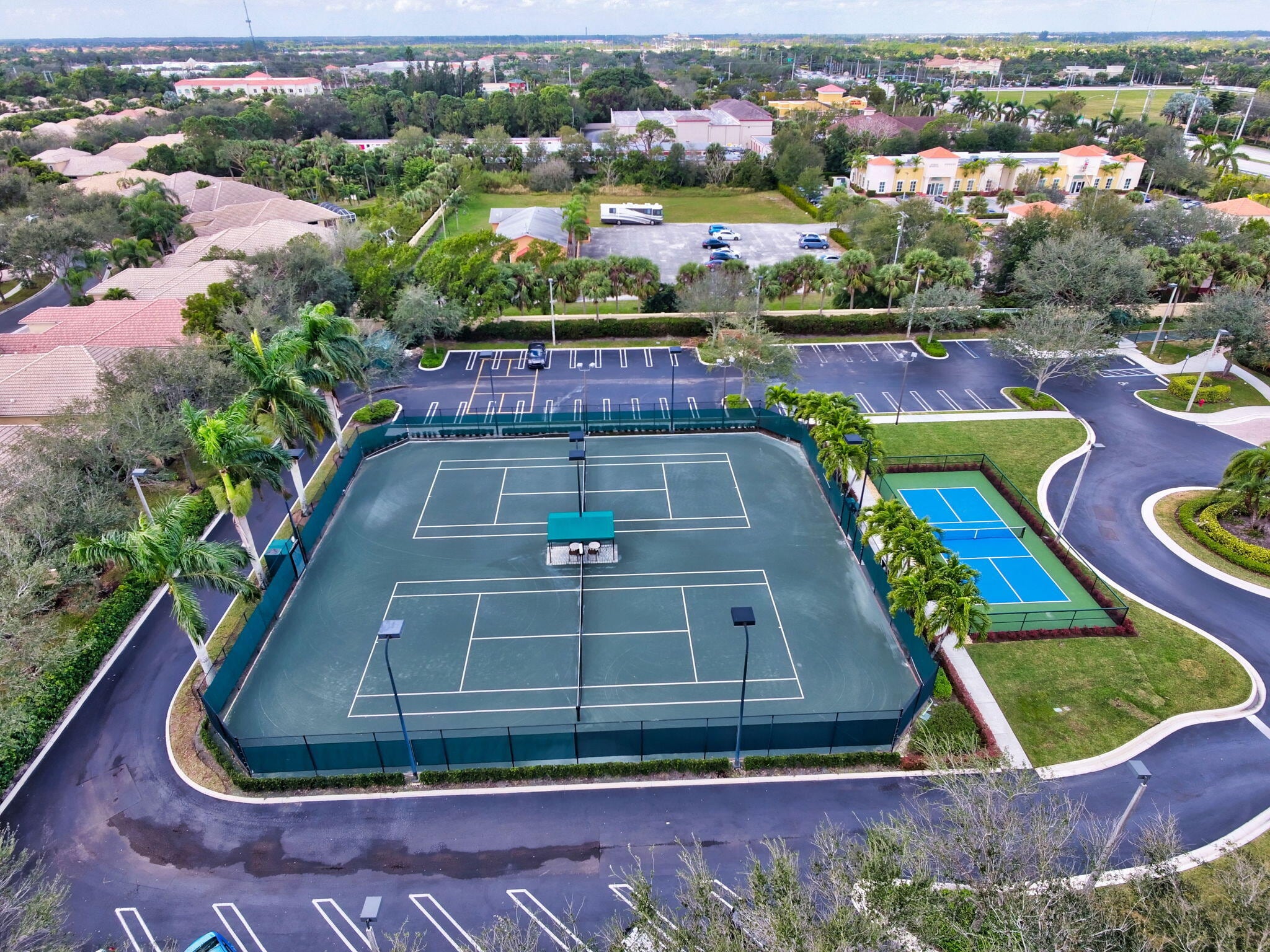 Aerial view of tennis and pickleball courts at Mizner Falls
