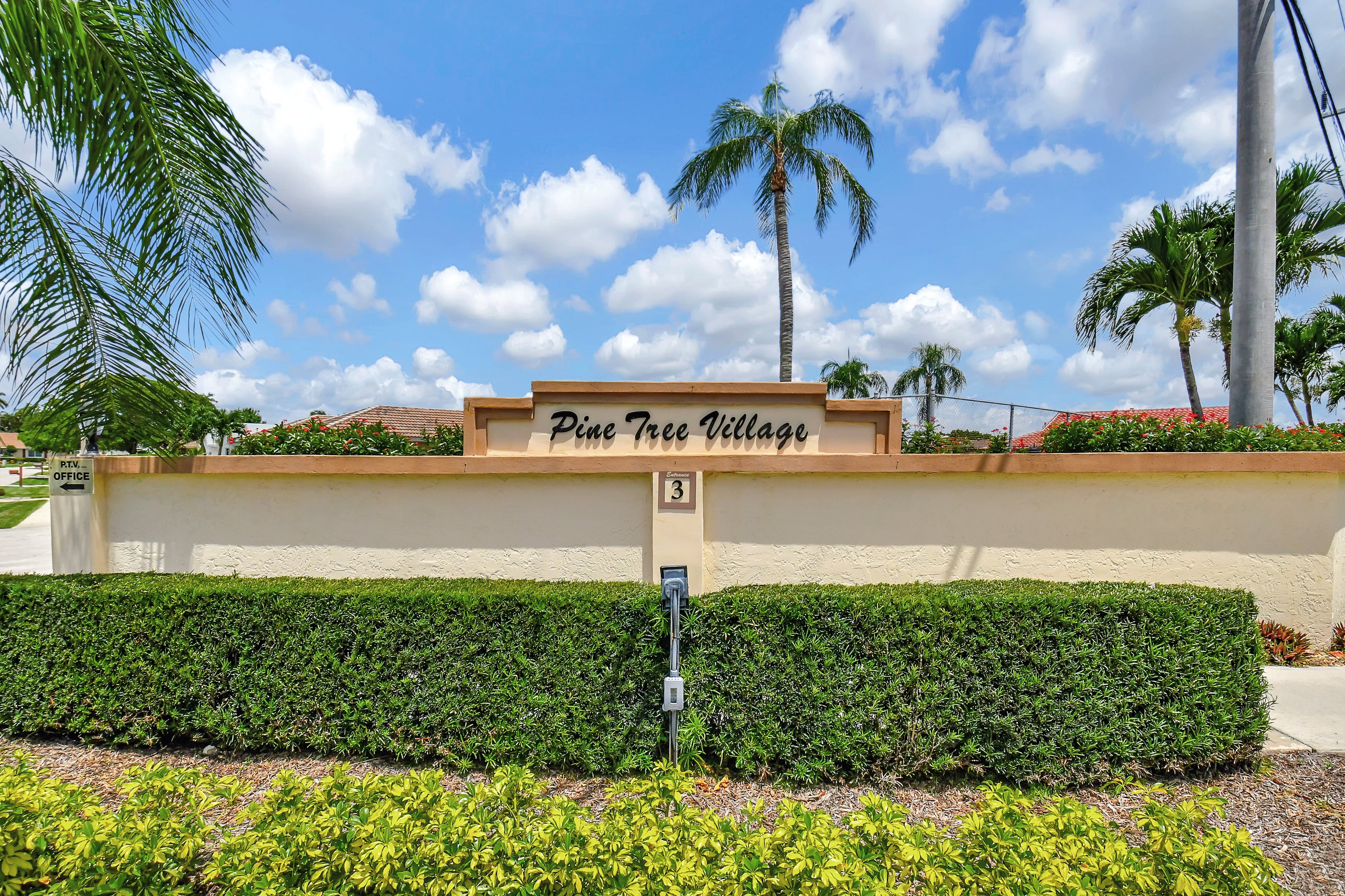 Pine Tree Village entrance sign