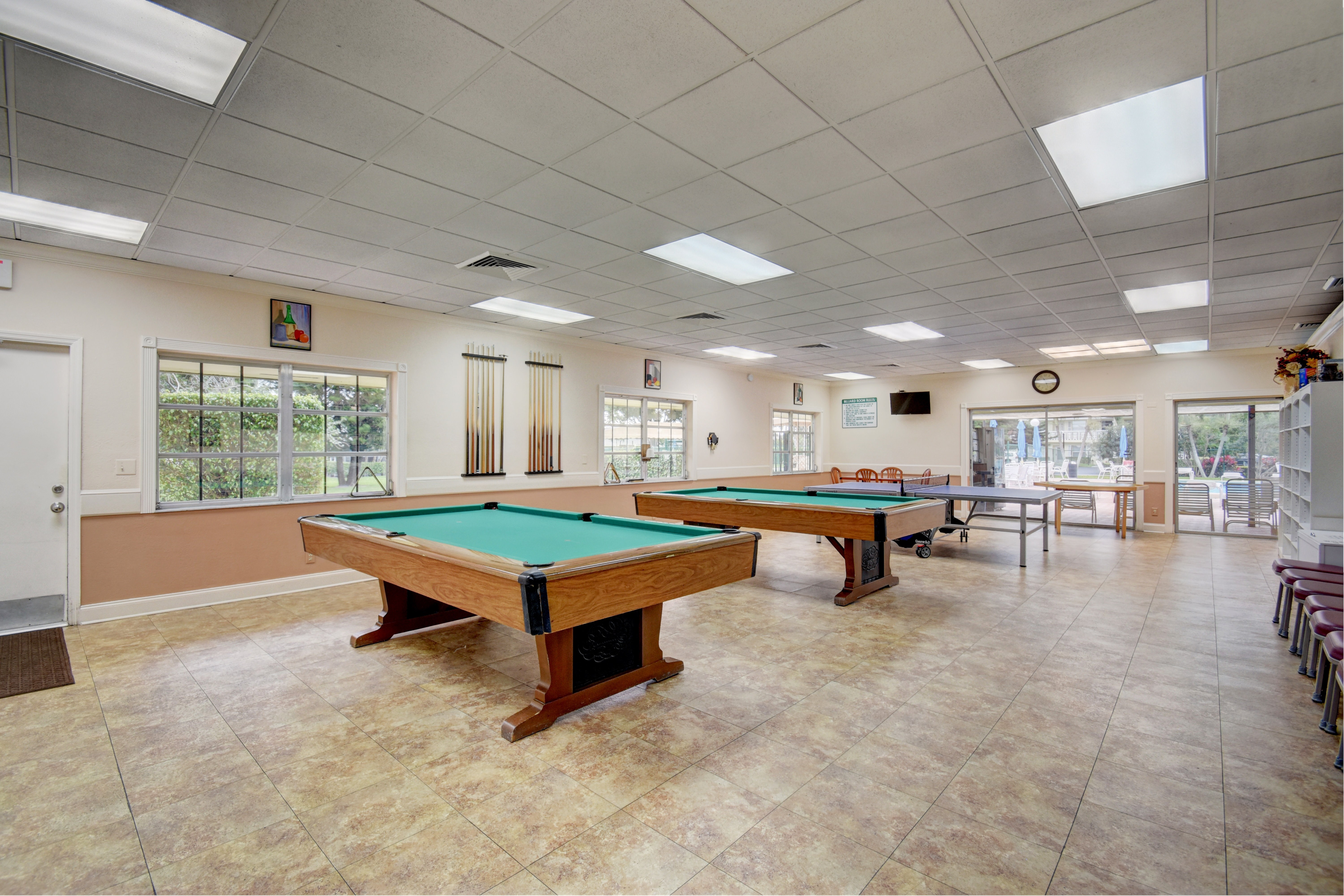 Pines of Delray billiards room with pool tables and recreation space