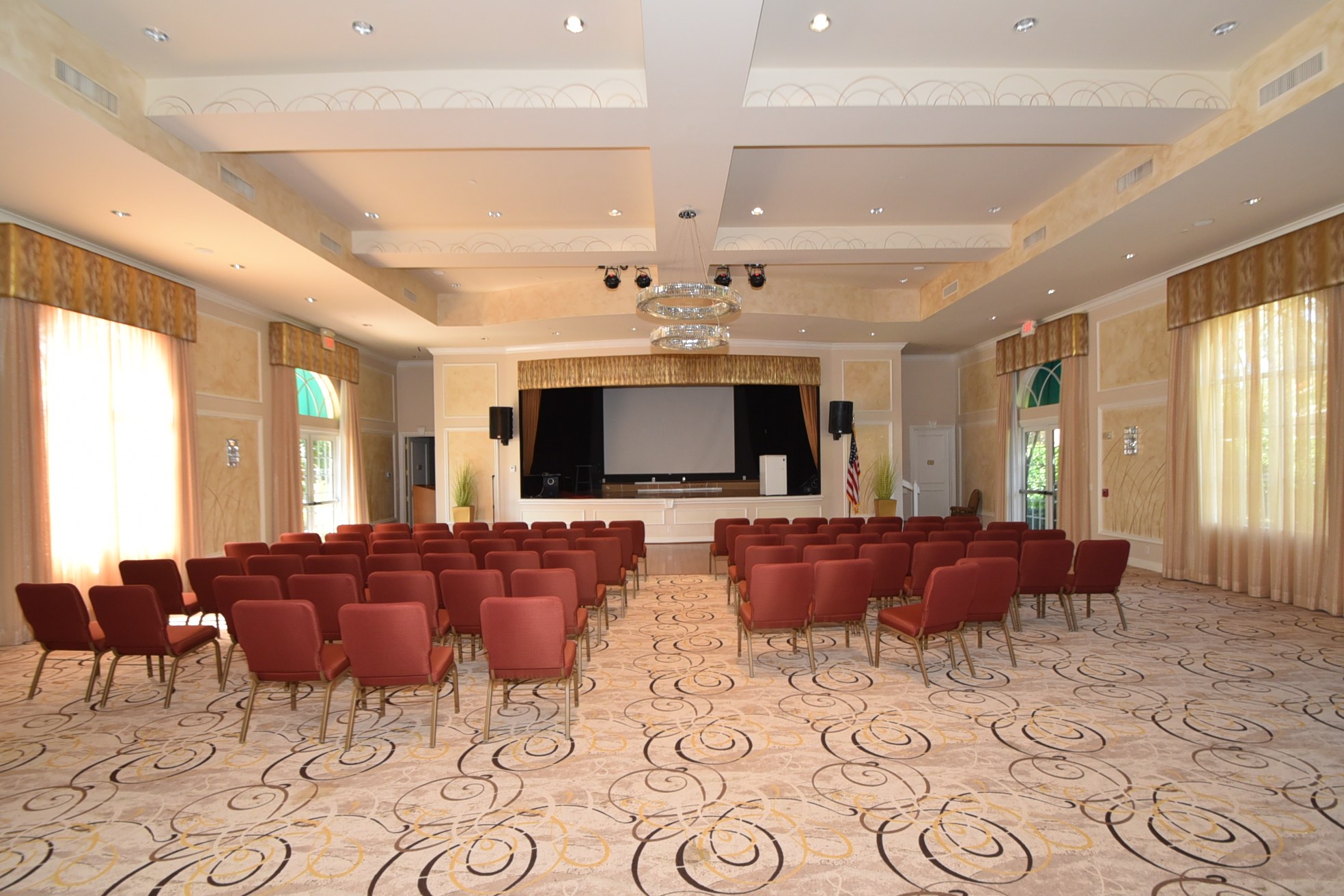 Ponte Vecchio West clubhouse theater with seating and stage