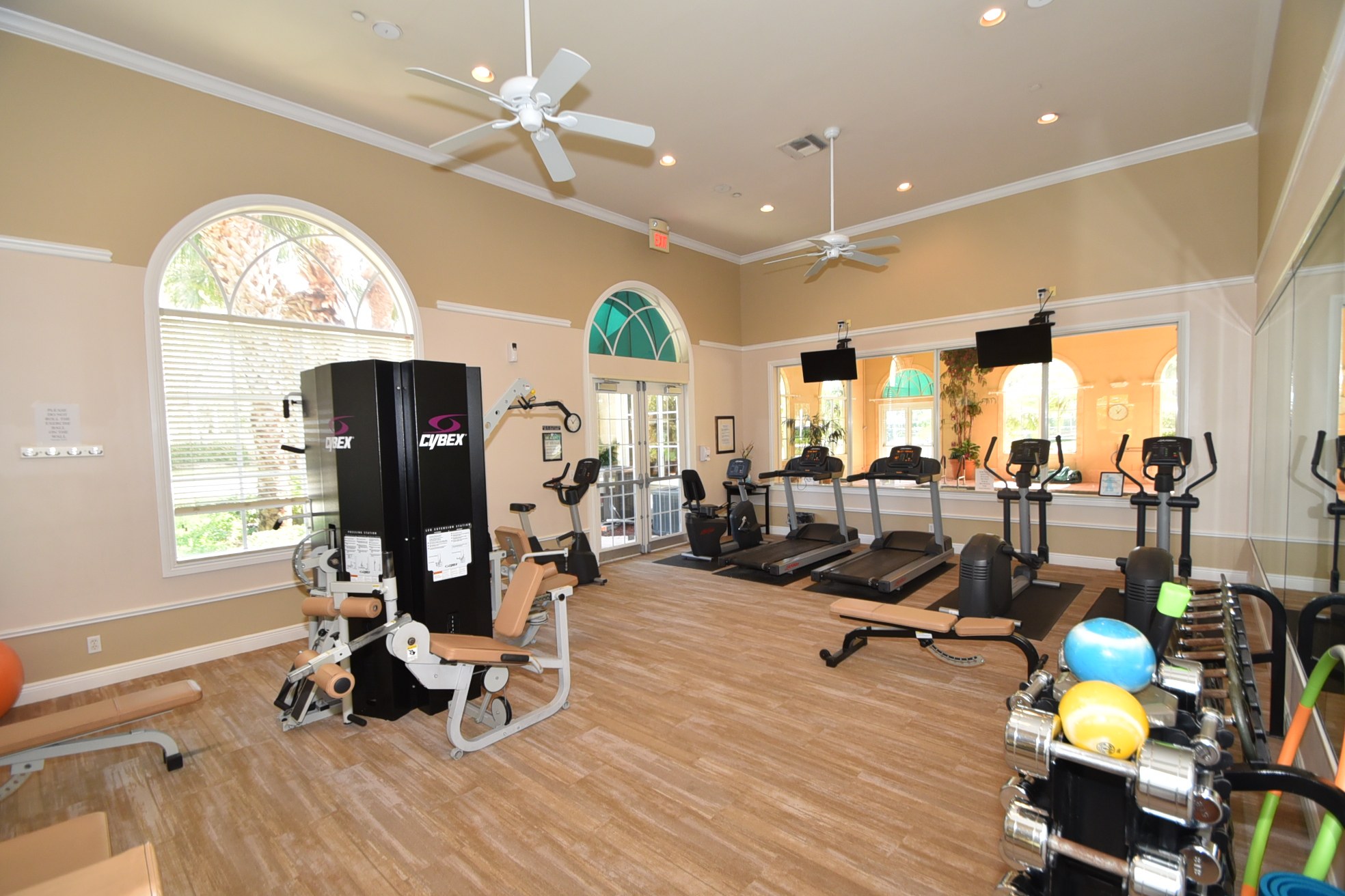 Fitness center with cardio and strength equipment at an active-adult clubhouse