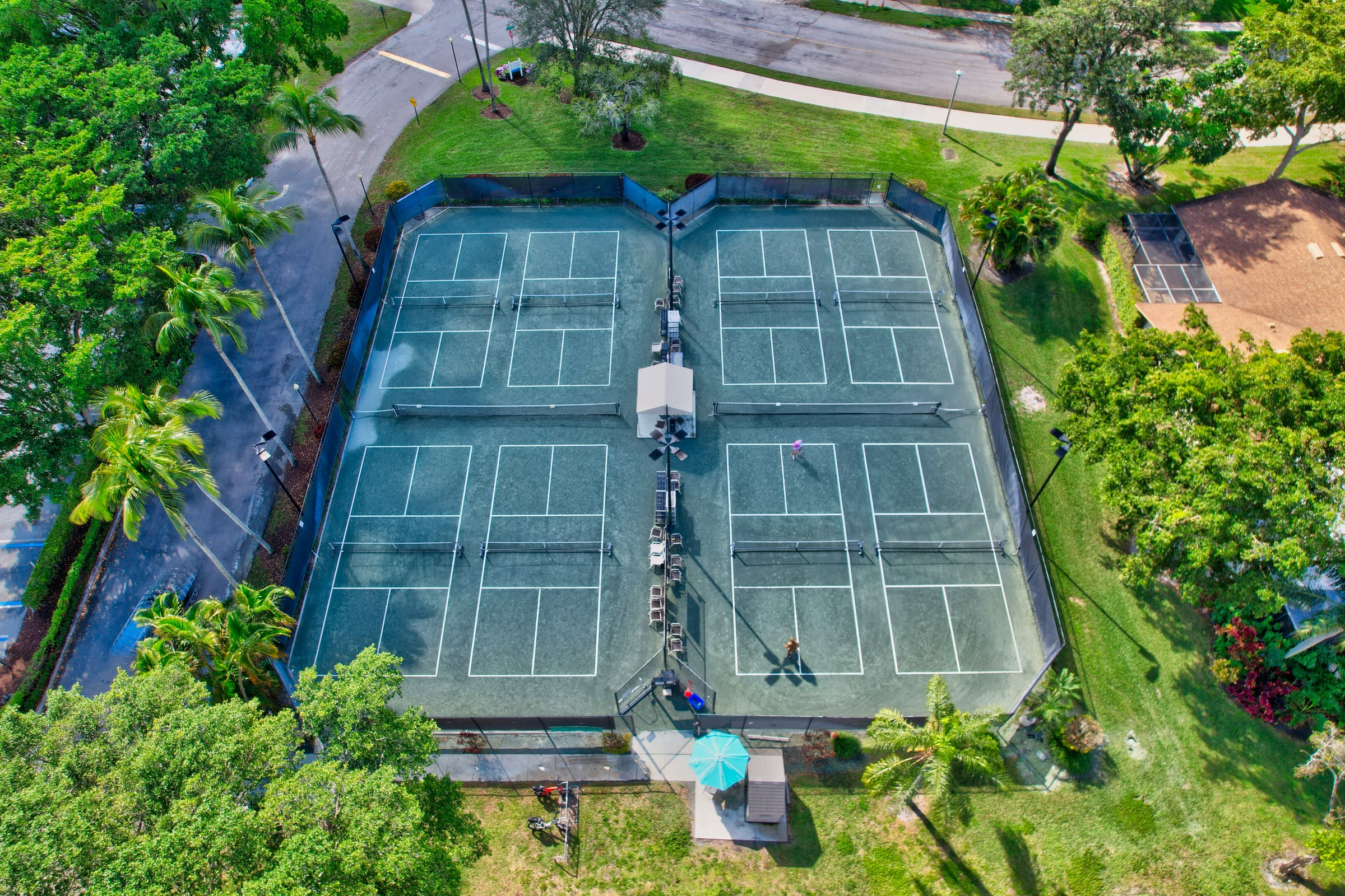 Aerial view of Rainberry Bay pickleball and tennis courts in Delray Beach