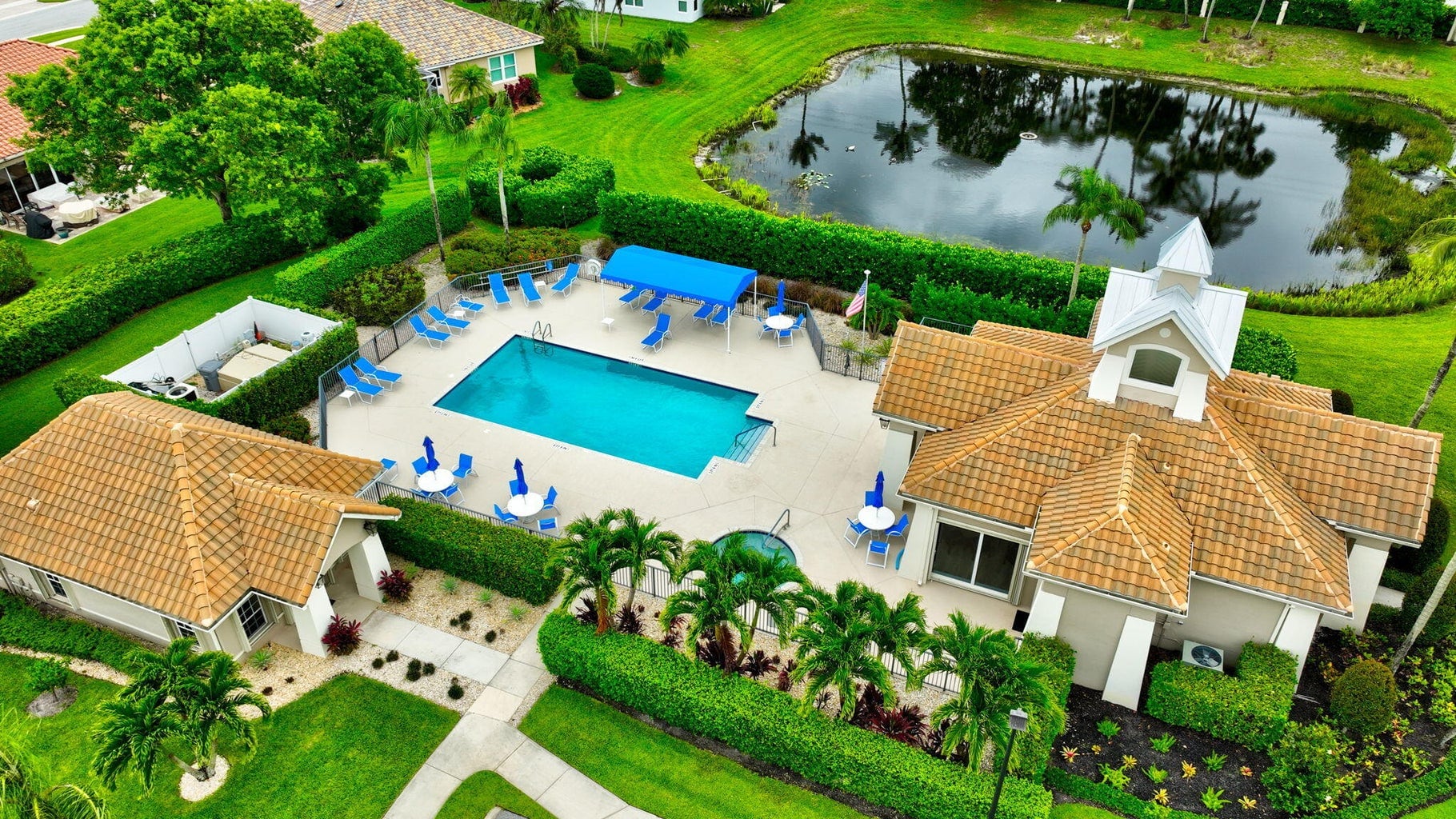 Aerial view of Sandhurst clubhouse, pool and lake