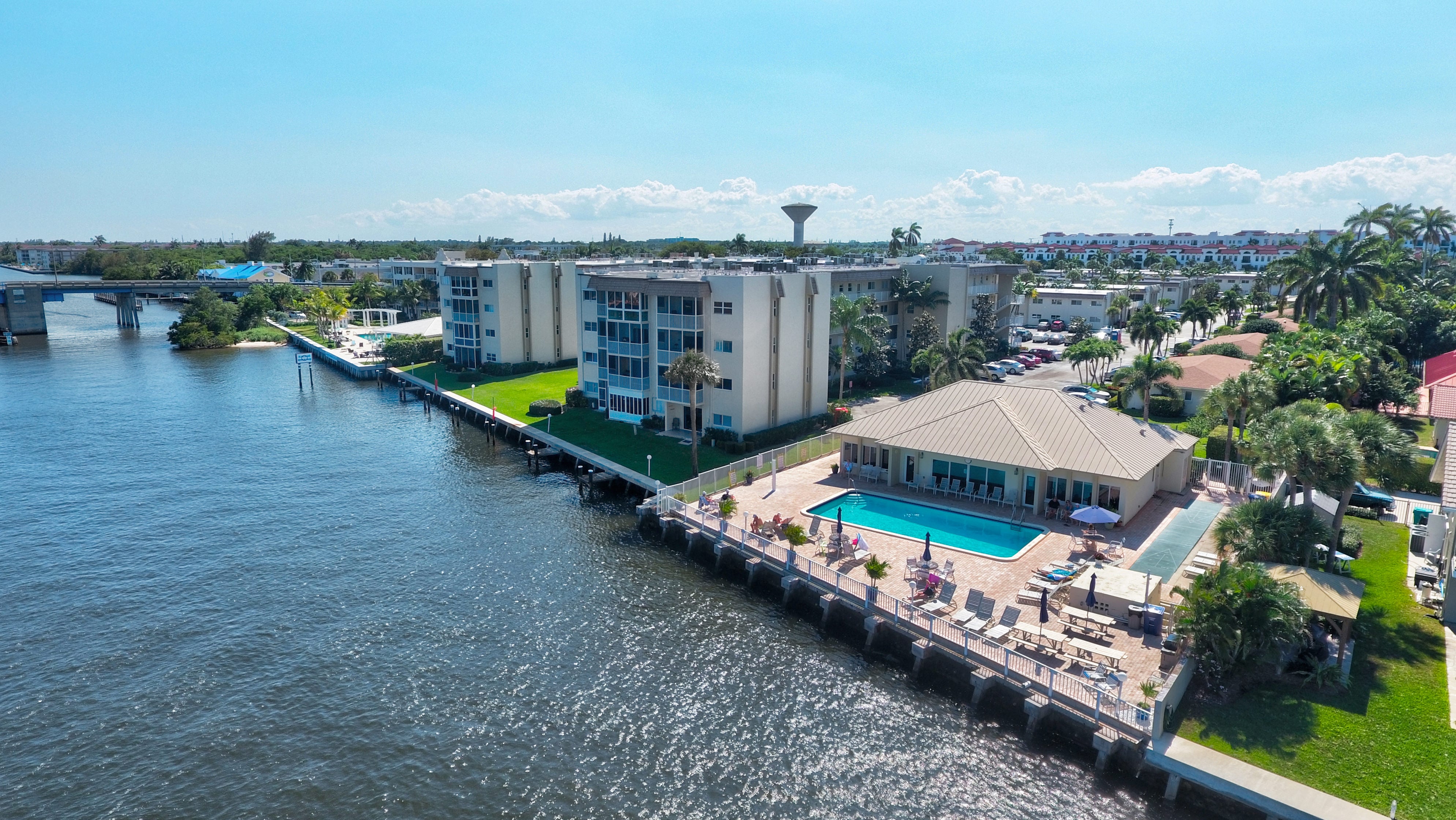 Aerial view of the Snug Harbor Gardens clubhouse and waterfront pool
