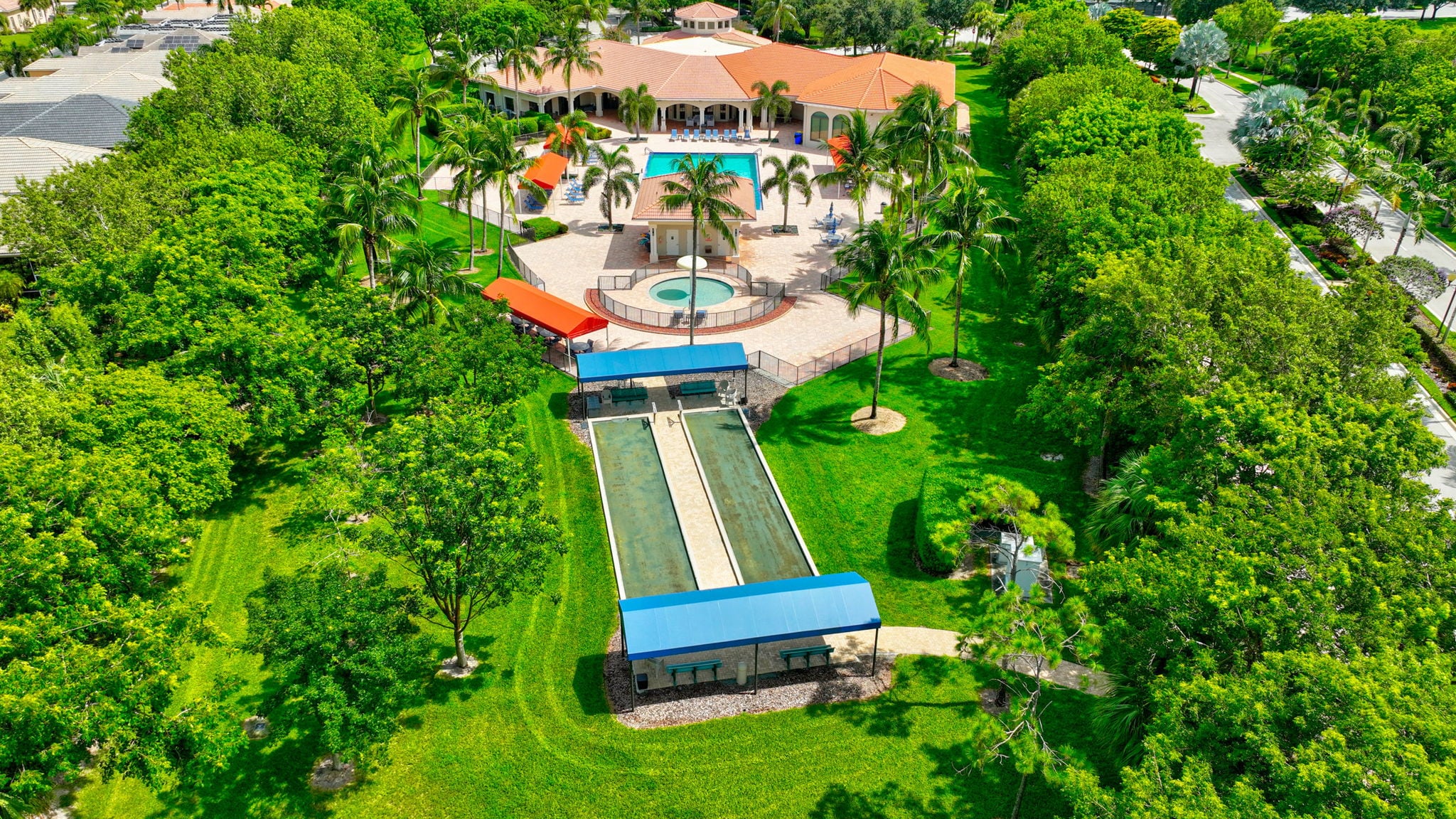 Aerial view of the Tivoli Lakes clubhouse and outdoor pool in Boynton Beach