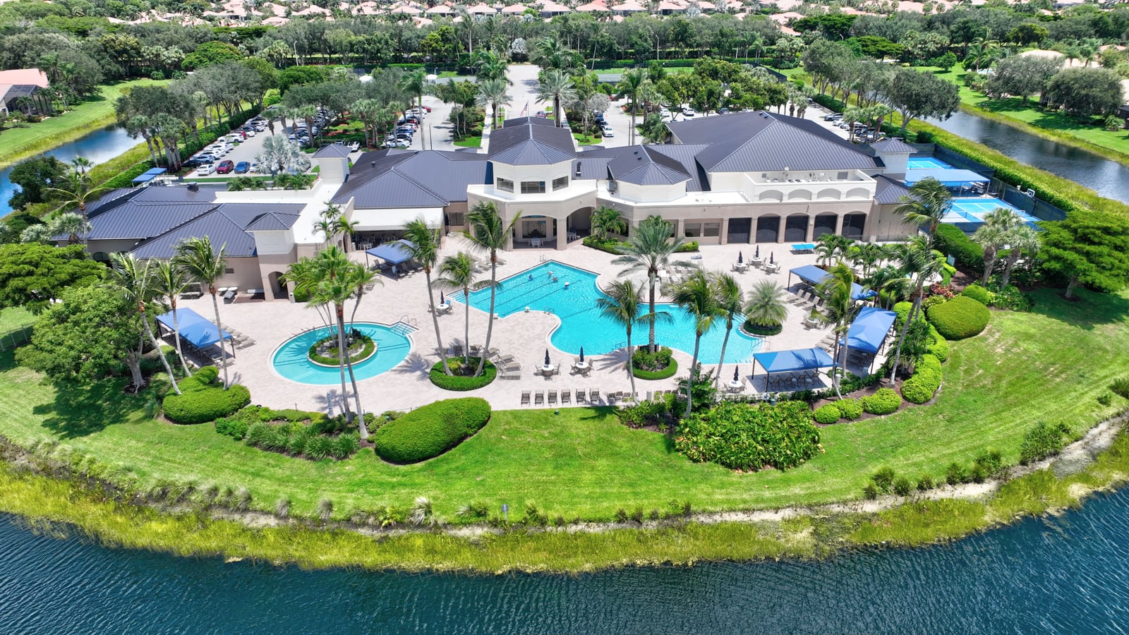 Racquet courts and clubhouse at Valencia Pointe in Boynton Beach