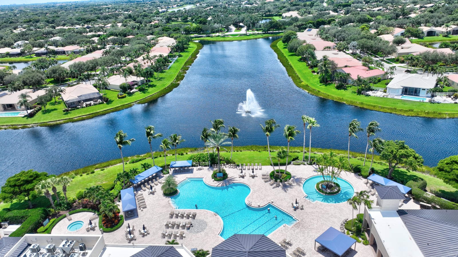 Clubhouse pool and lake at Valencia Pointe in Boynton Beach