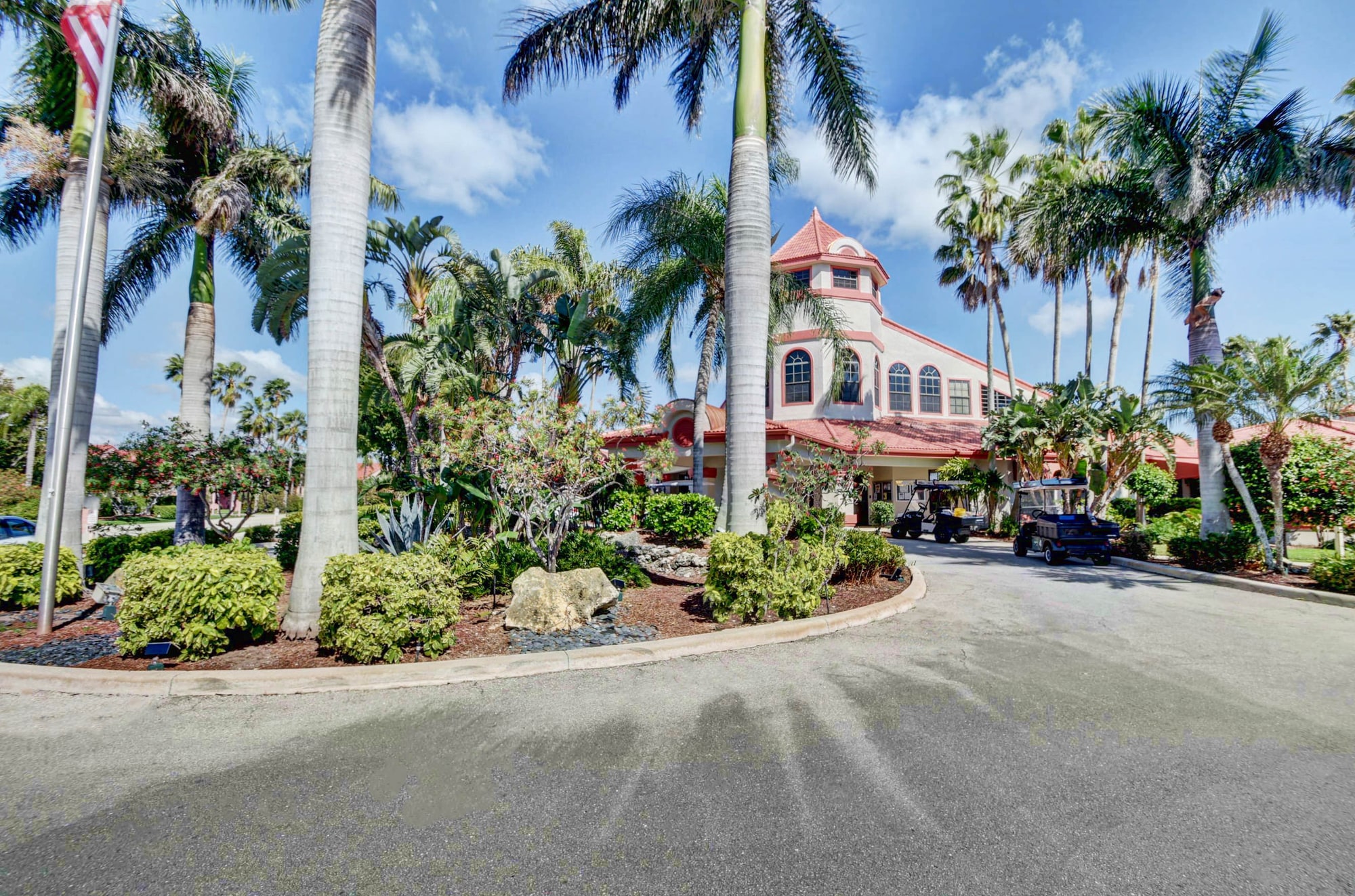 Palm-lined entrance to the Lexington Club clubhouse