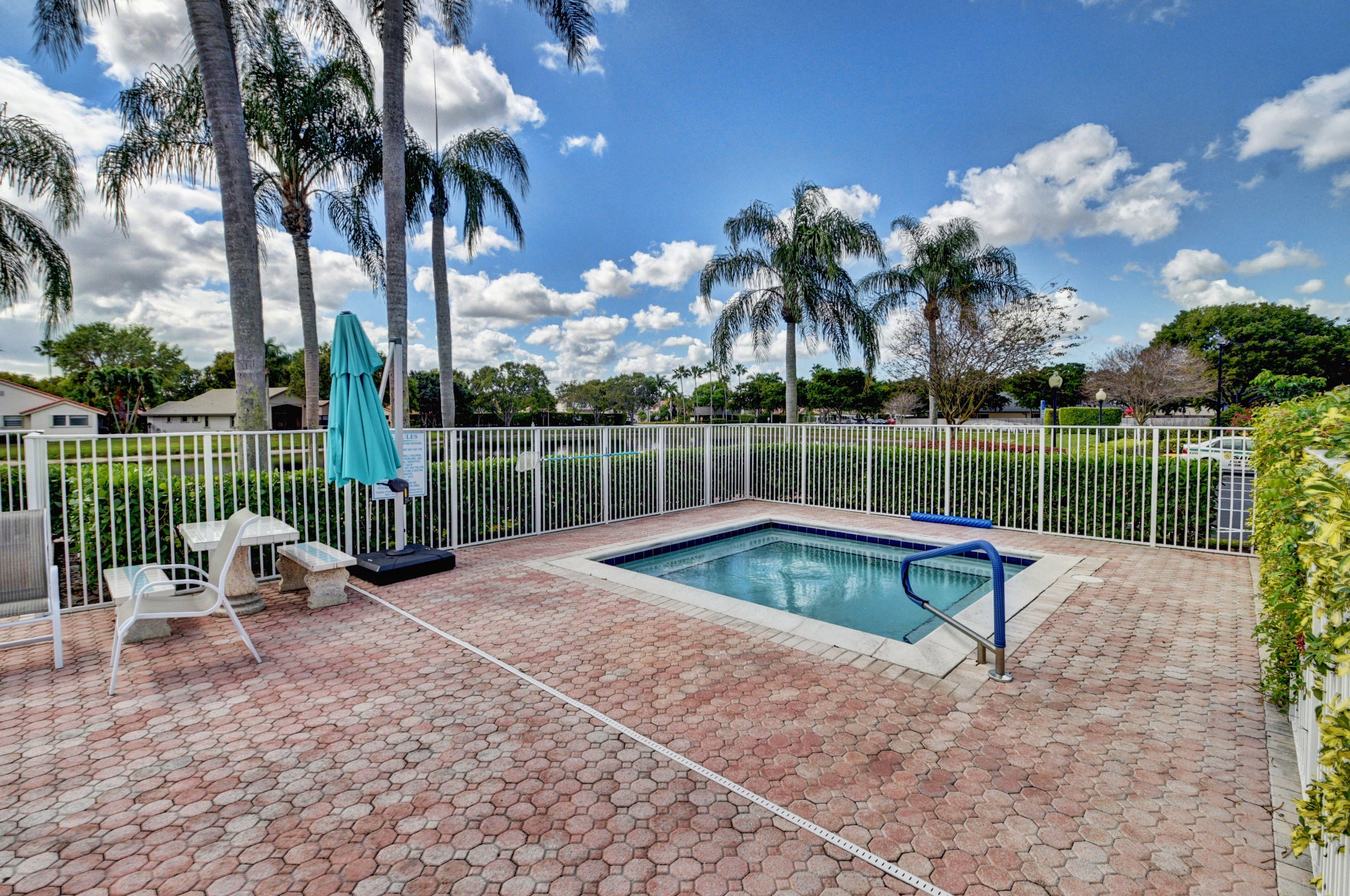 Palm Shores outdoor spa beside the pool deck