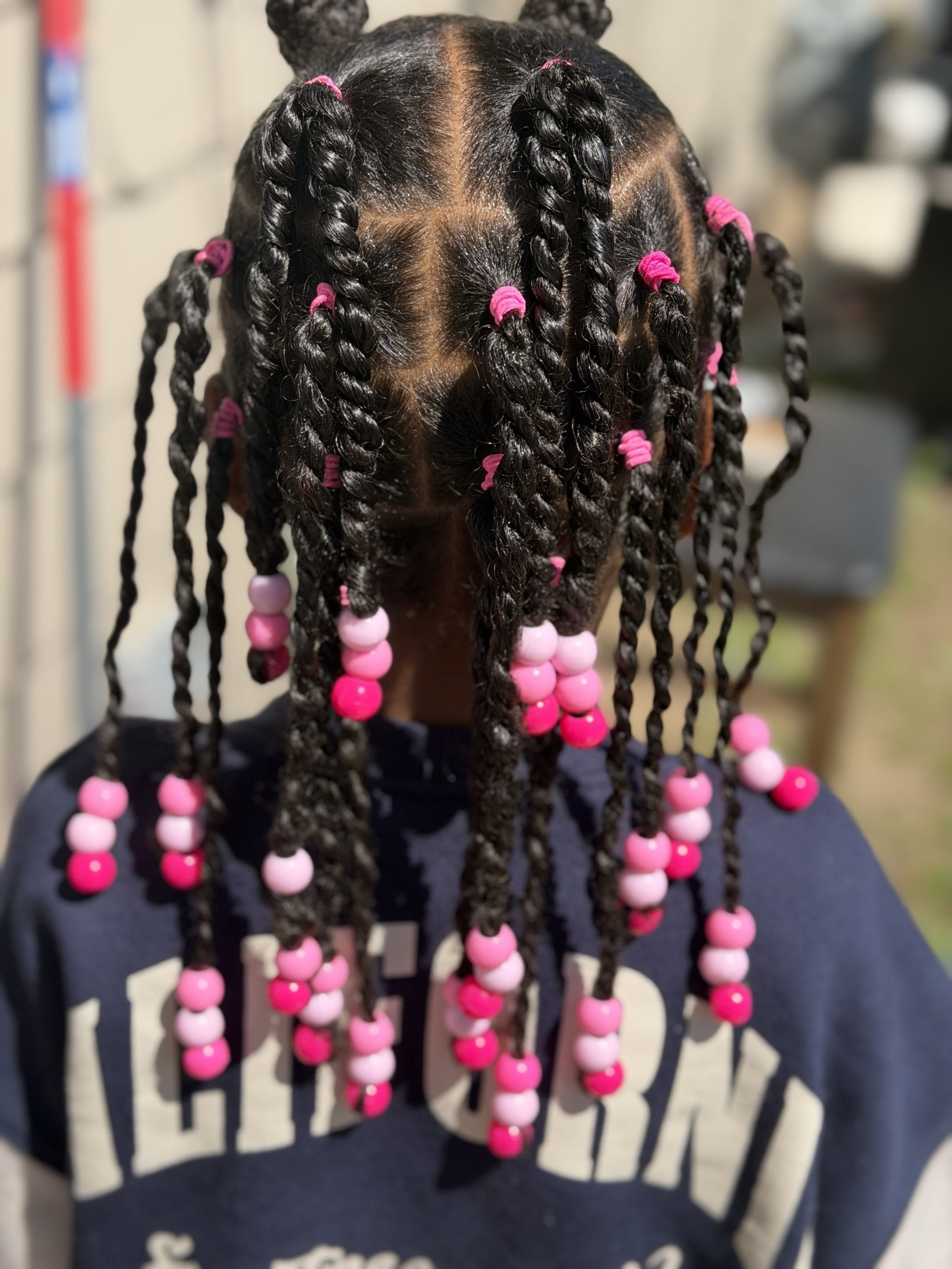 Child's finished braided style with pink beads