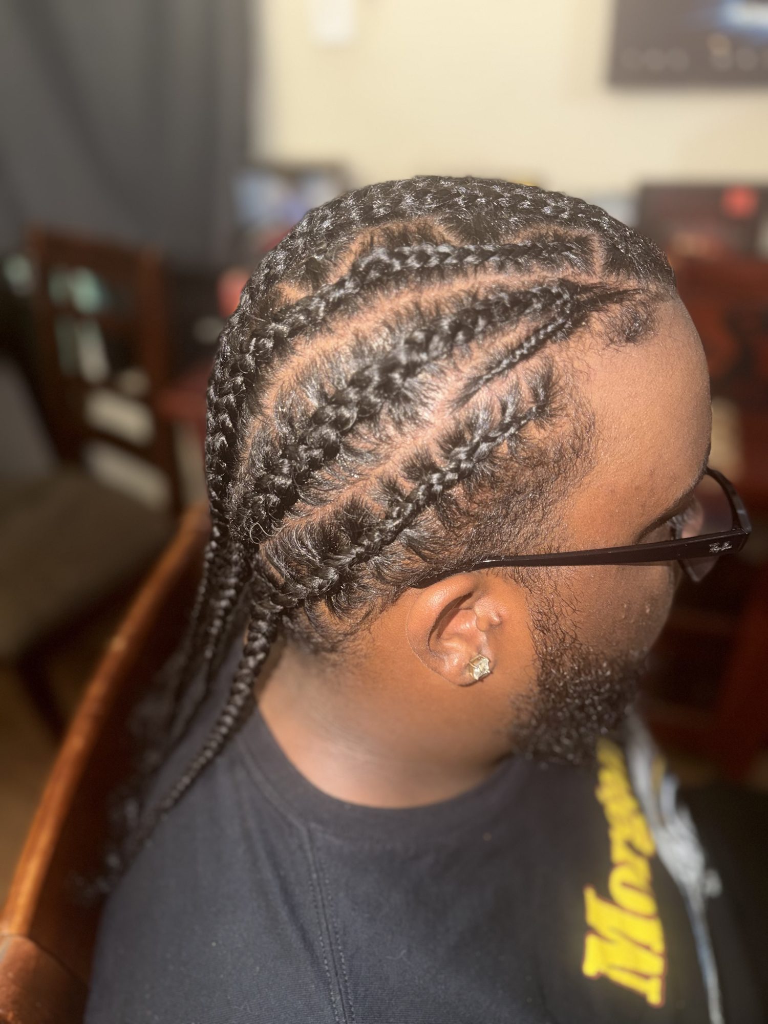 Natural cornrow style with curved braid patterns