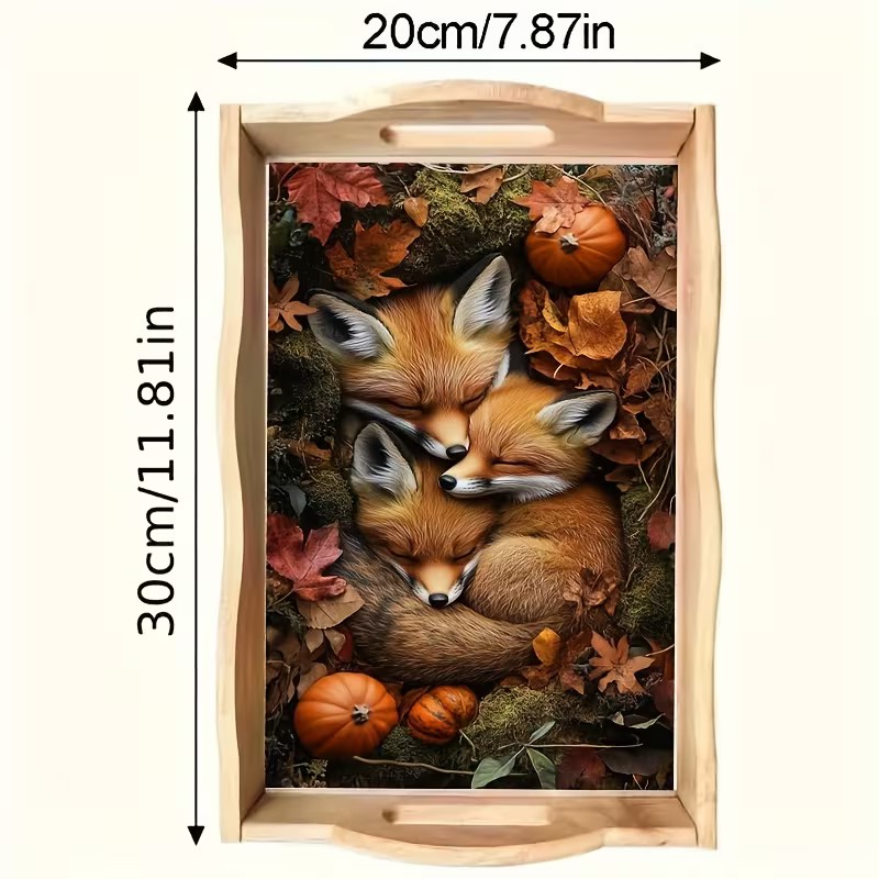 Three baby foxes sleeping together among autumn leaves and pumpkins on a decorative tray