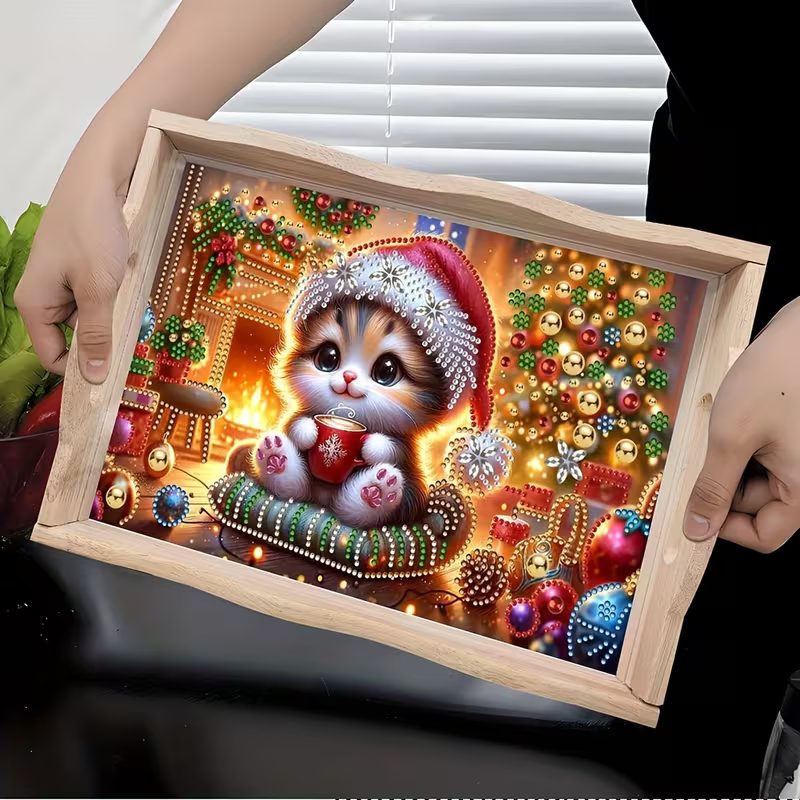 Mistletoe Whiskers diamond art design with a kitten in a Santa hat holding a red mug beside festive decorations