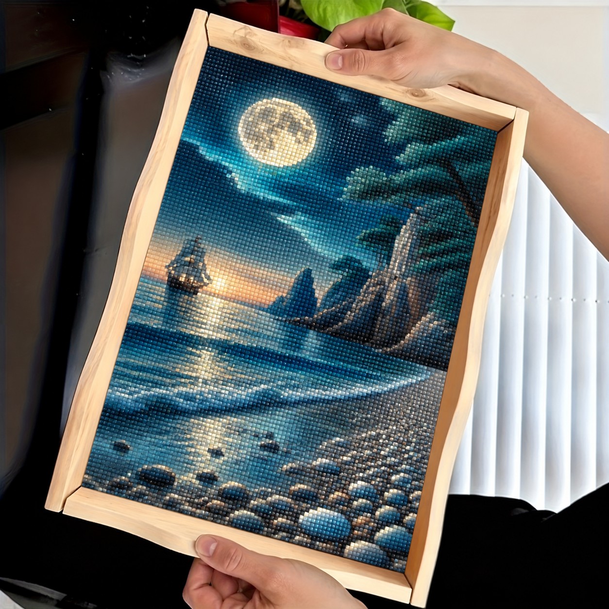 Finished Moonlit Seas diamond art tray with a full moon, sailing ship, lighthouse, and ocean waves