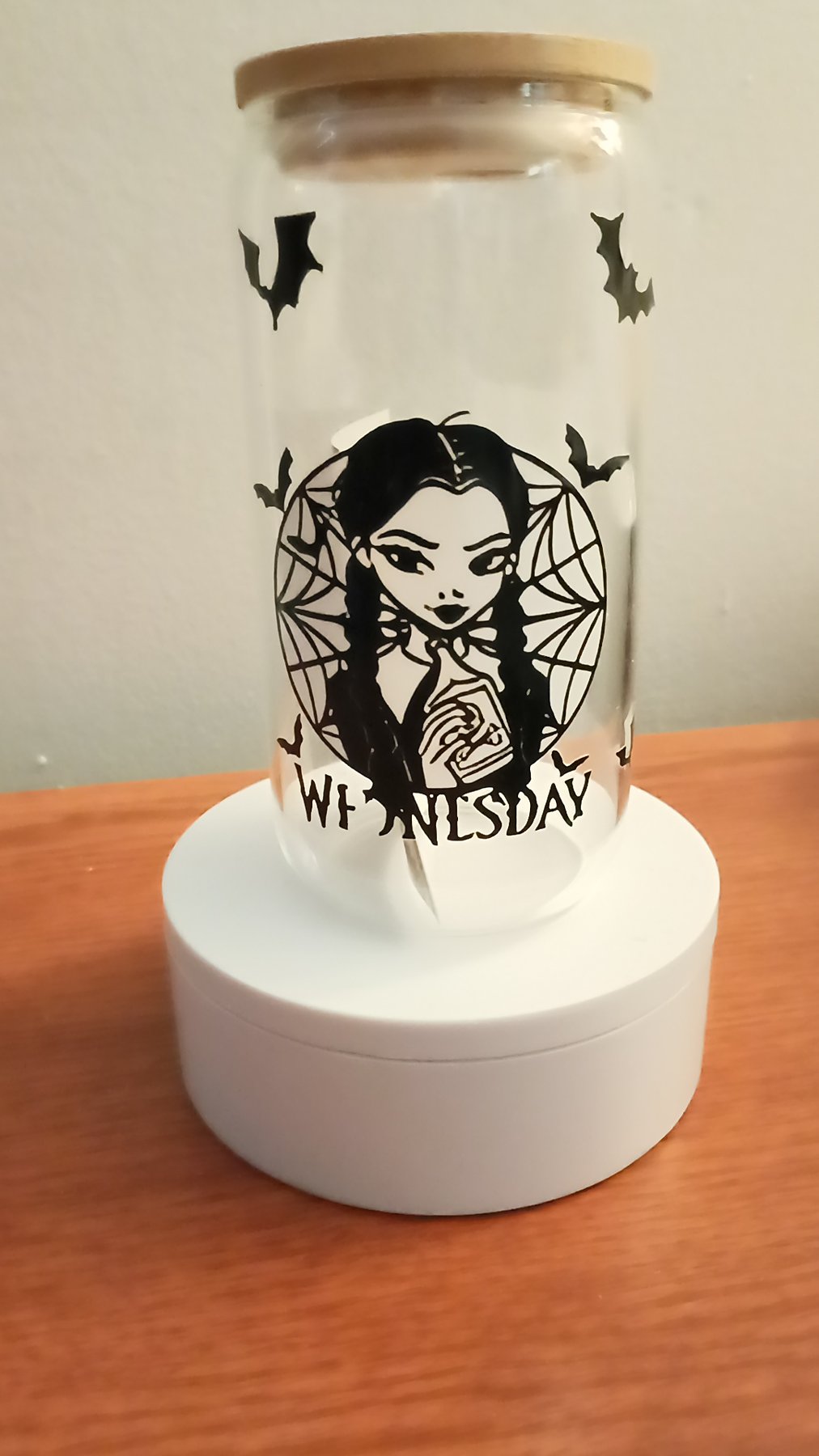 Actual Wednesday glass cup with bats, a wooden lid, and a black character design