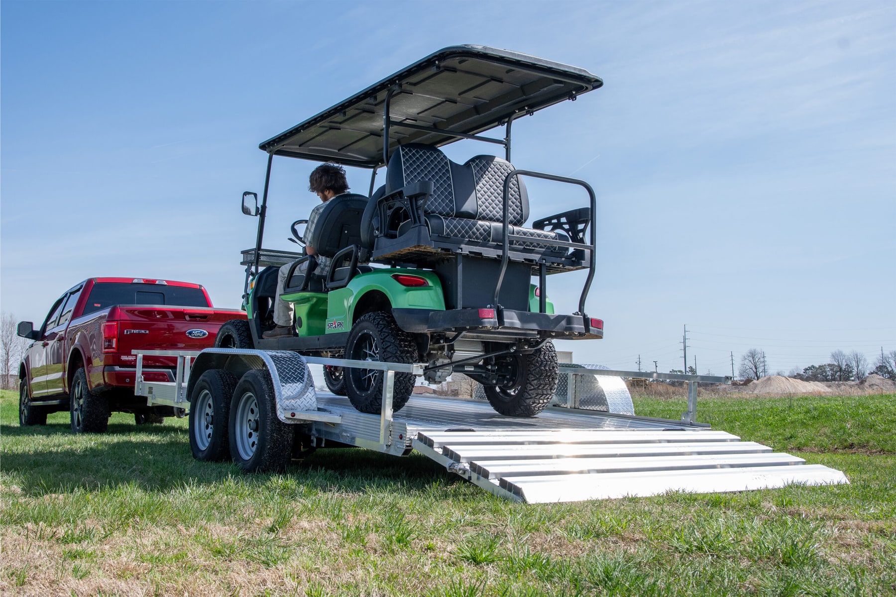FANG 16 foot tandem aluminum utility trailer shown with a golf cart