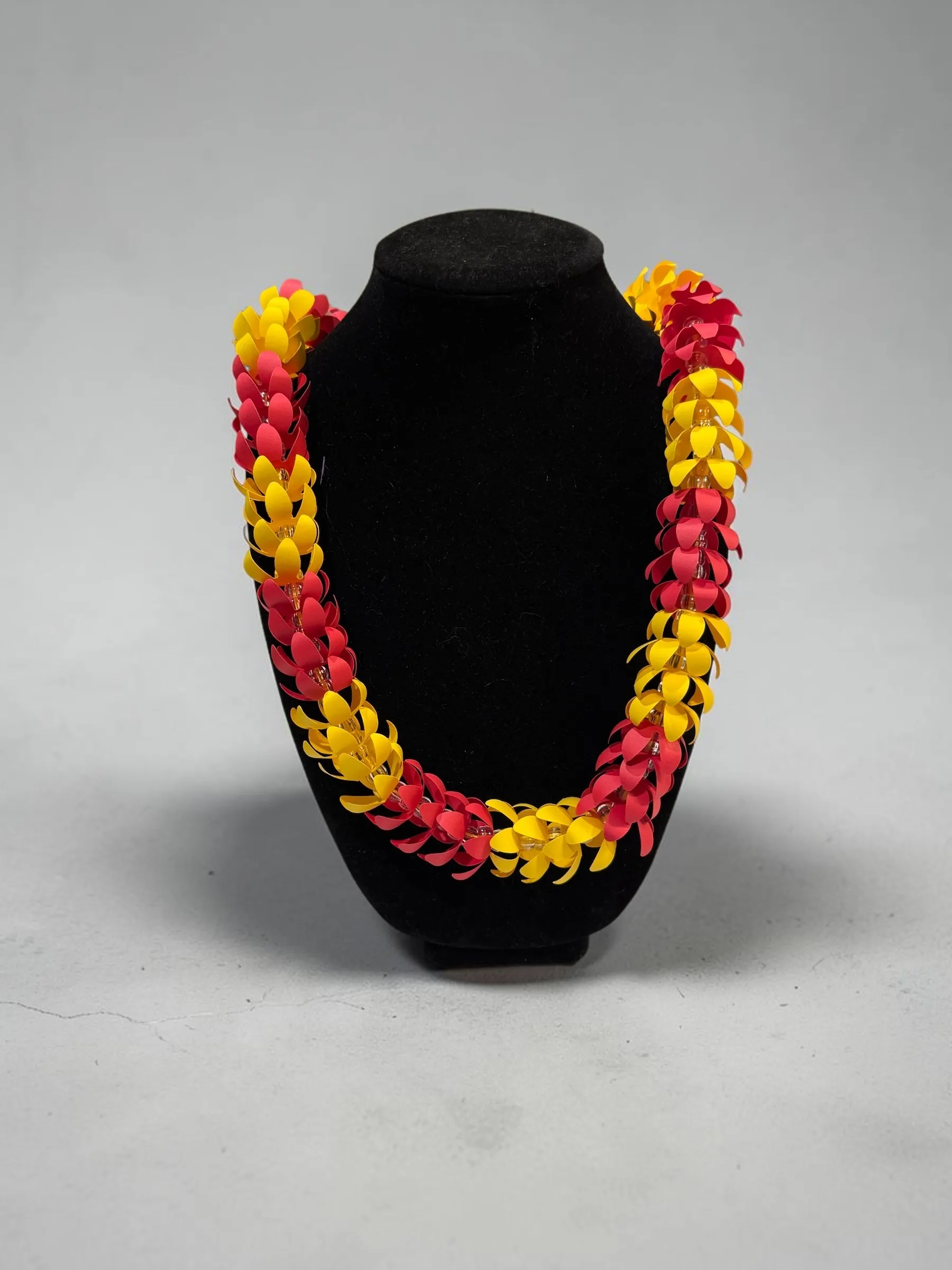 Handmade paper lei in pink and yellow