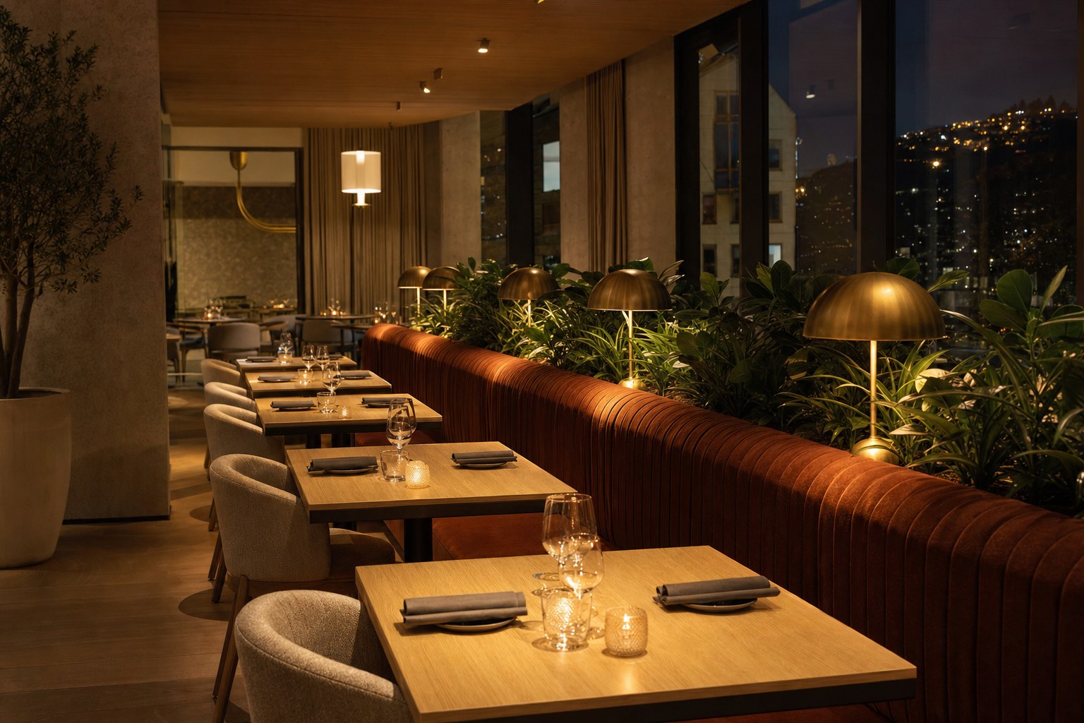 Hotel lounge with patterned seating, wood furniture and layered lighting
