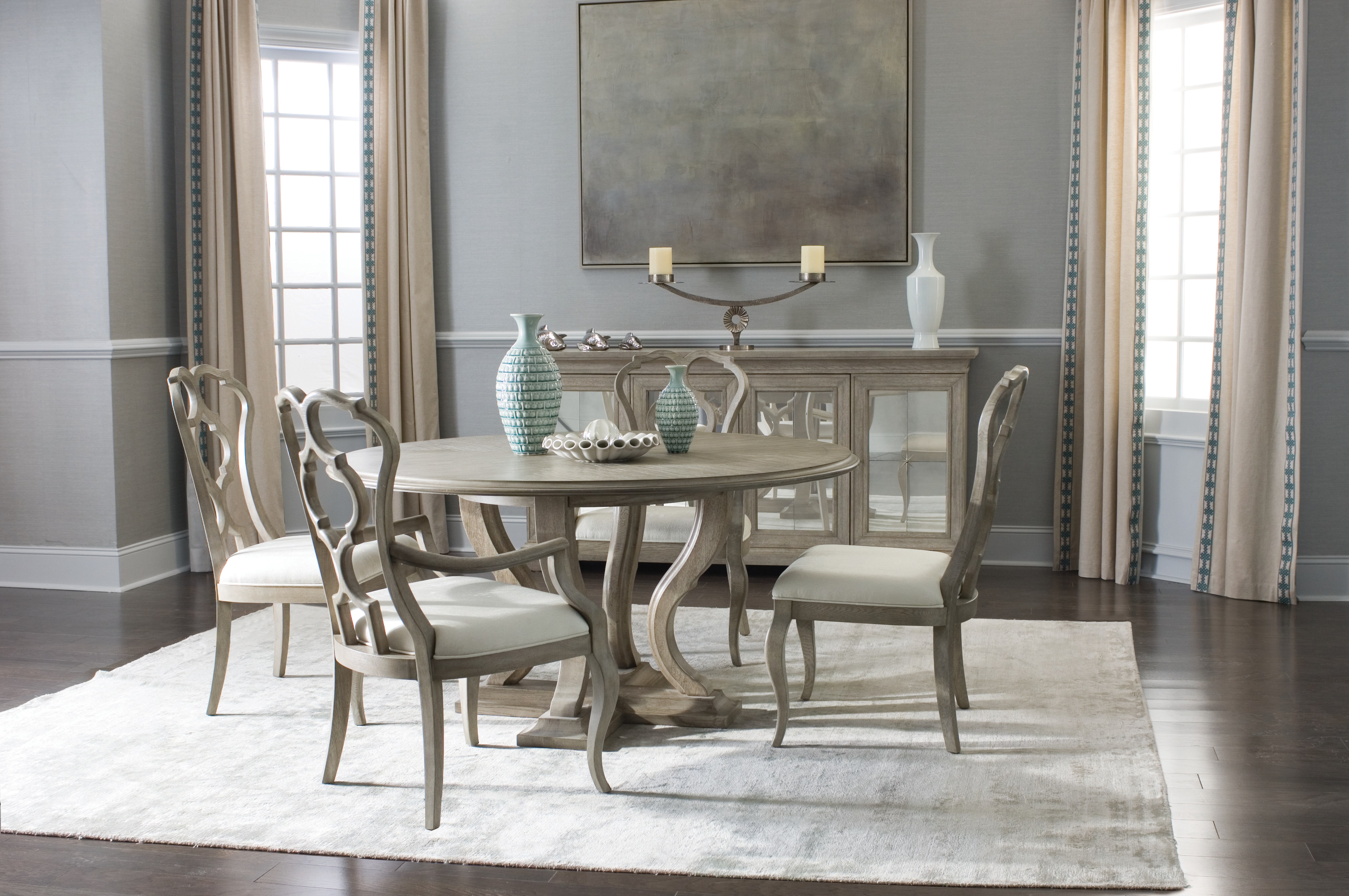 Hospitality lounge with upholstered seating, tables and warm wood detailing