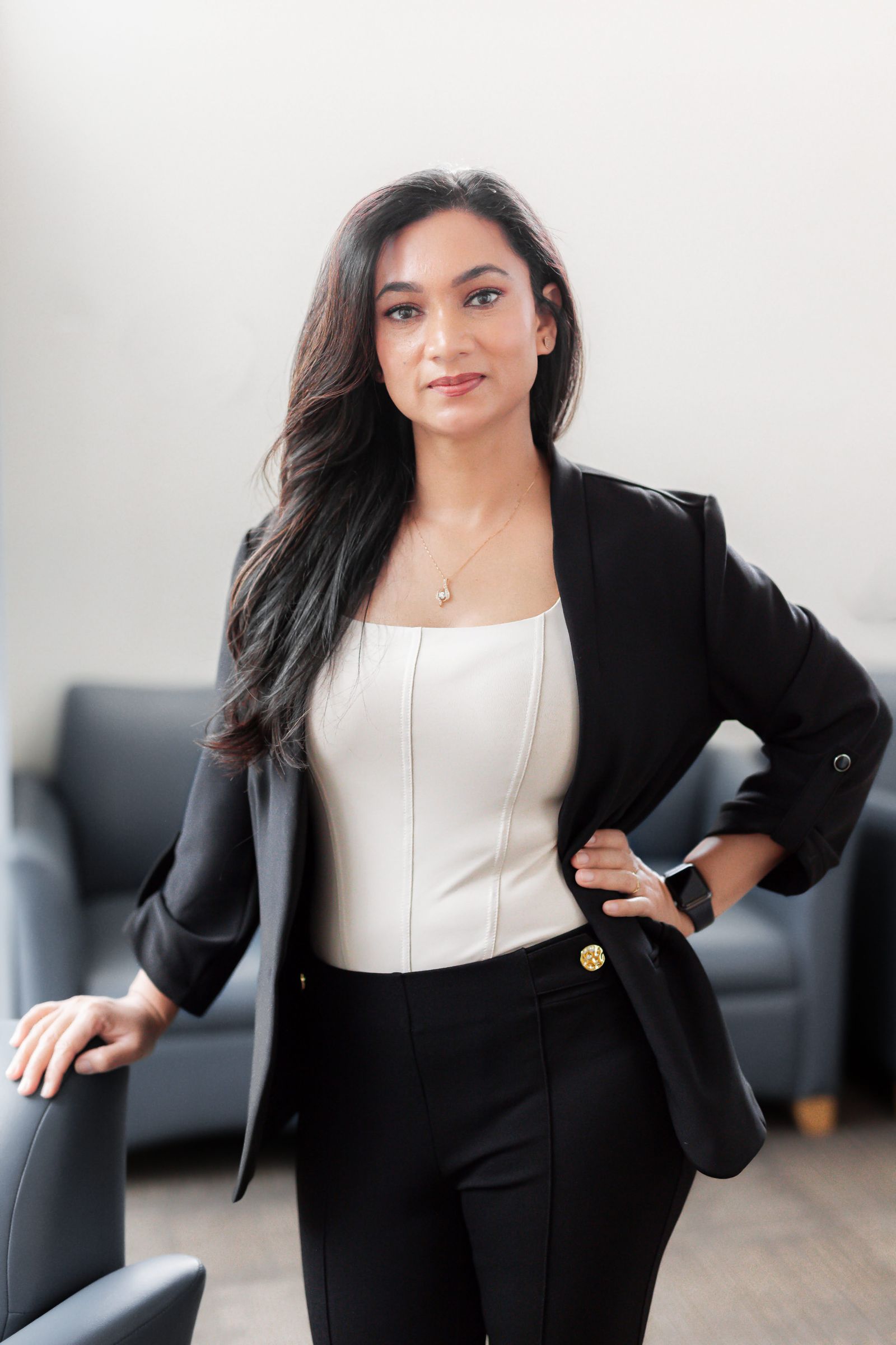 Amardeep Kaur, founder of AB House of Aesthetics, in a black blazer