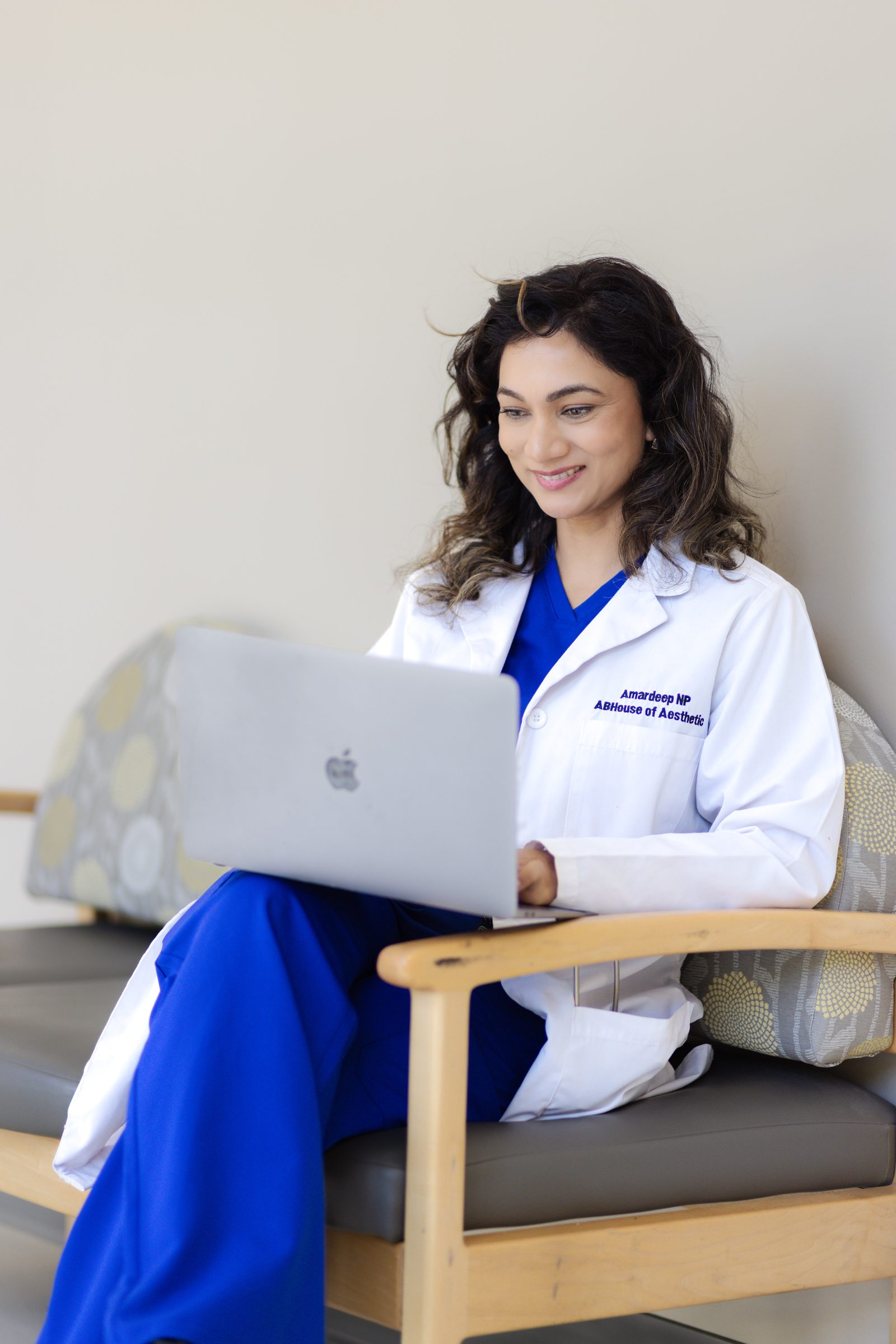 Amardeep Kaur at her laptop, ready to discuss personalized care