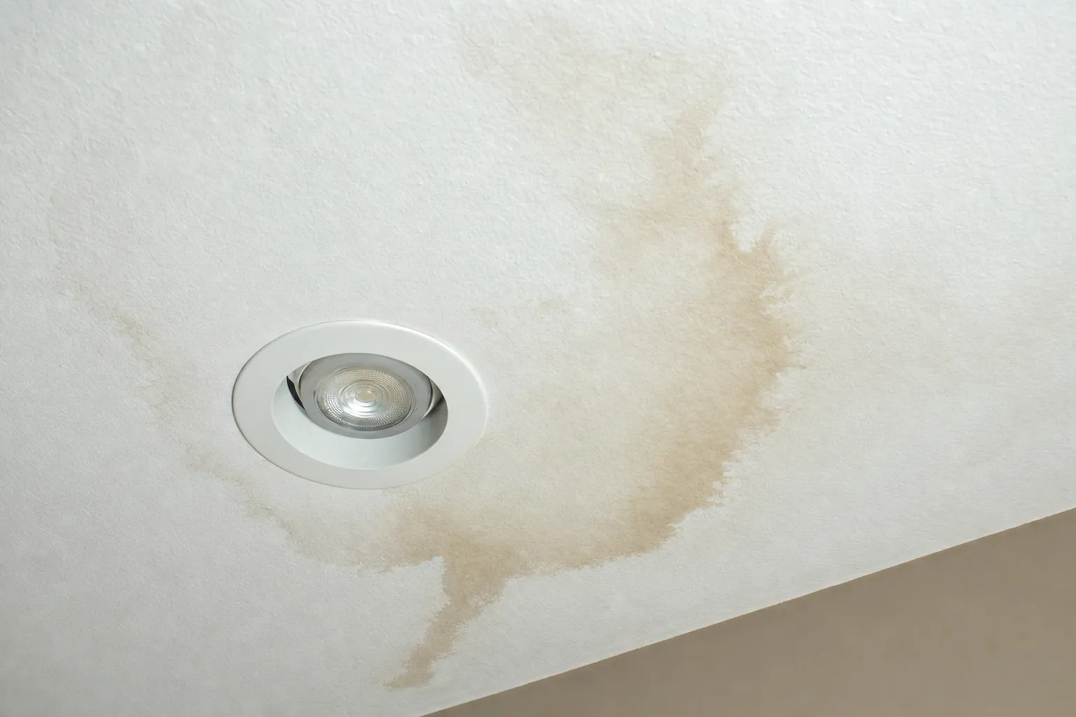 Water stain around a recessed ceiling light