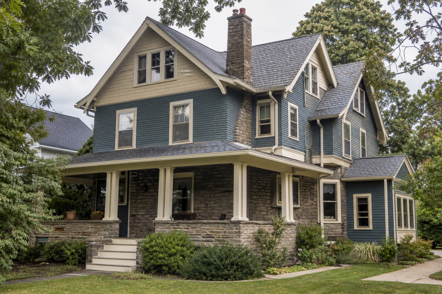 Older two-story home with multiple rooflines and exterior details