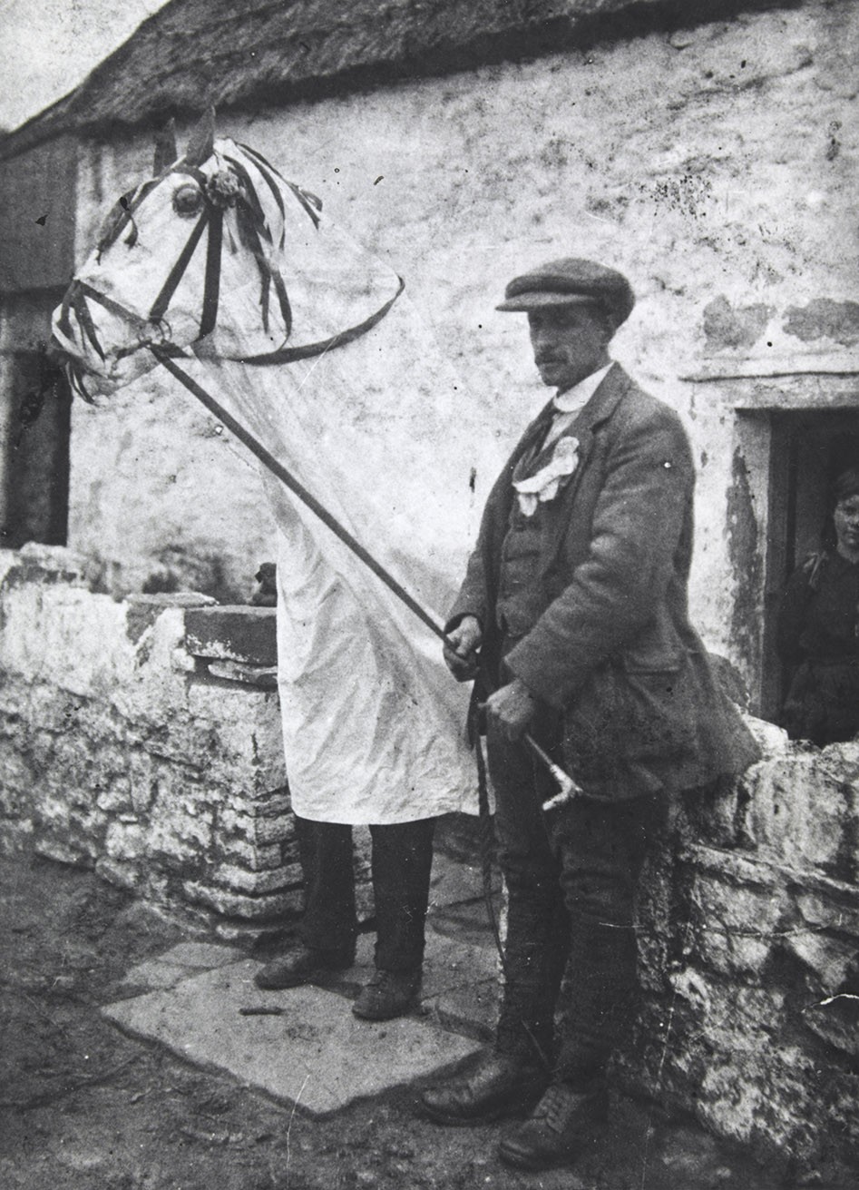 The Mari Lwyd and its bearer at Llangynwyd, circa 1910 to 1914.