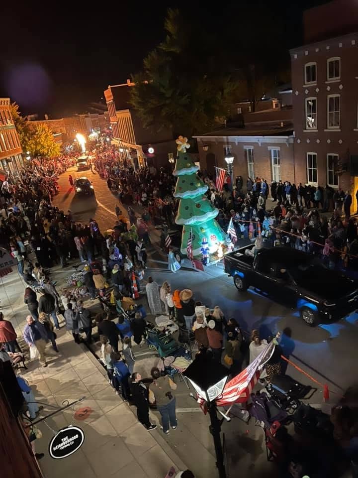 A nighttime view over crowds at the Galena Halloween Parade
