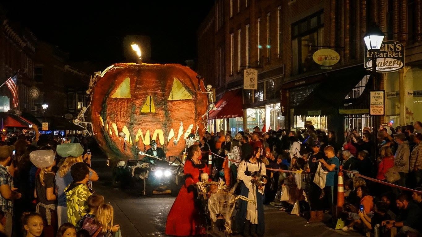A giant jack-o'-lantern float moving through Galena's Halloween Parade