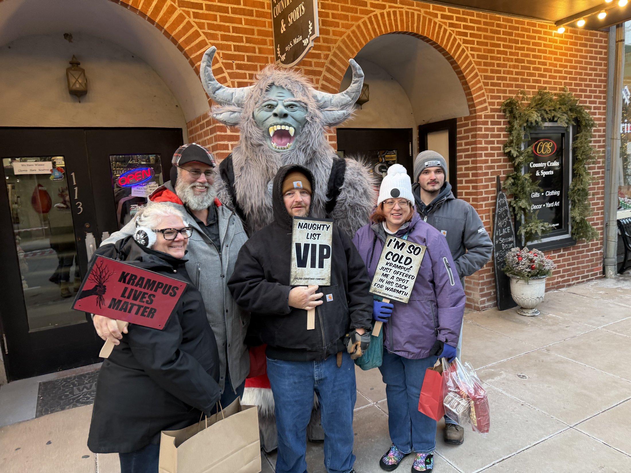 Krampy with visitors at Country Crafts & Sports during Galena’s Night of Luminaria and Living Windows, photo 1