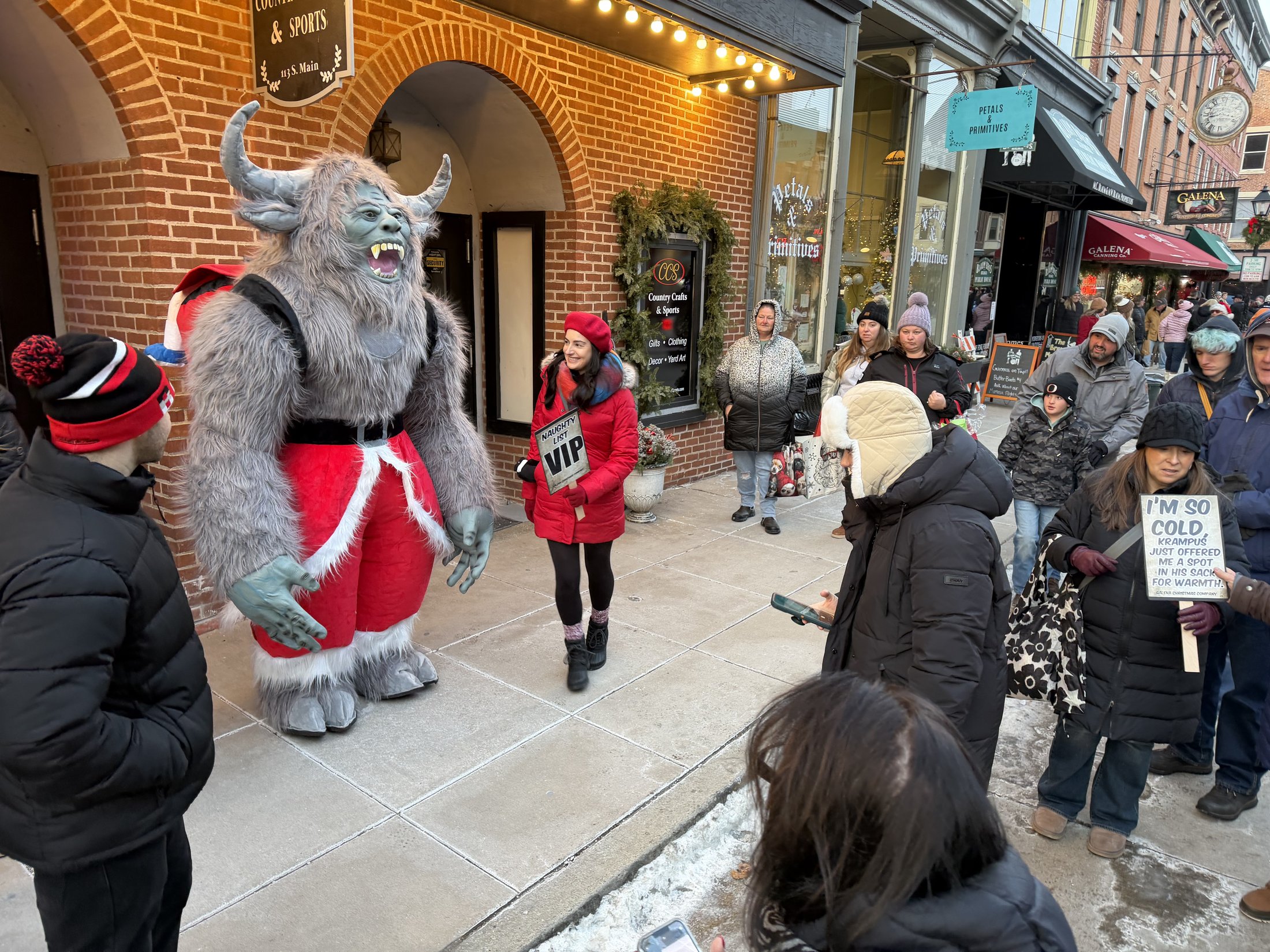 Krampy with visitors at Country Crafts & Sports during Galena’s Night of Luminaria and Living Windows, photo 3