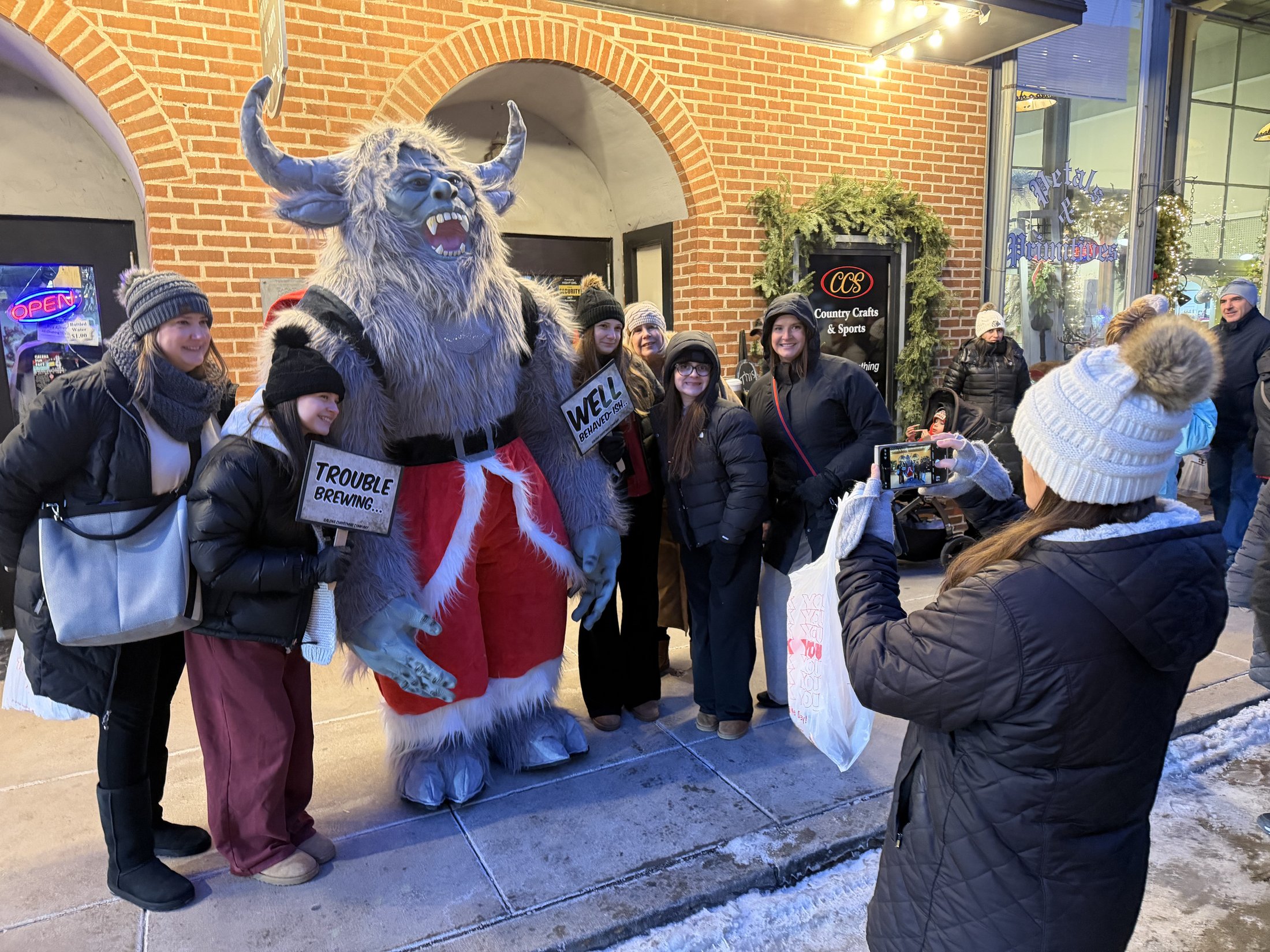 Krampy with visitors at Country Crafts & Sports during Galena’s Night of Luminaria and Living Windows, photo 6