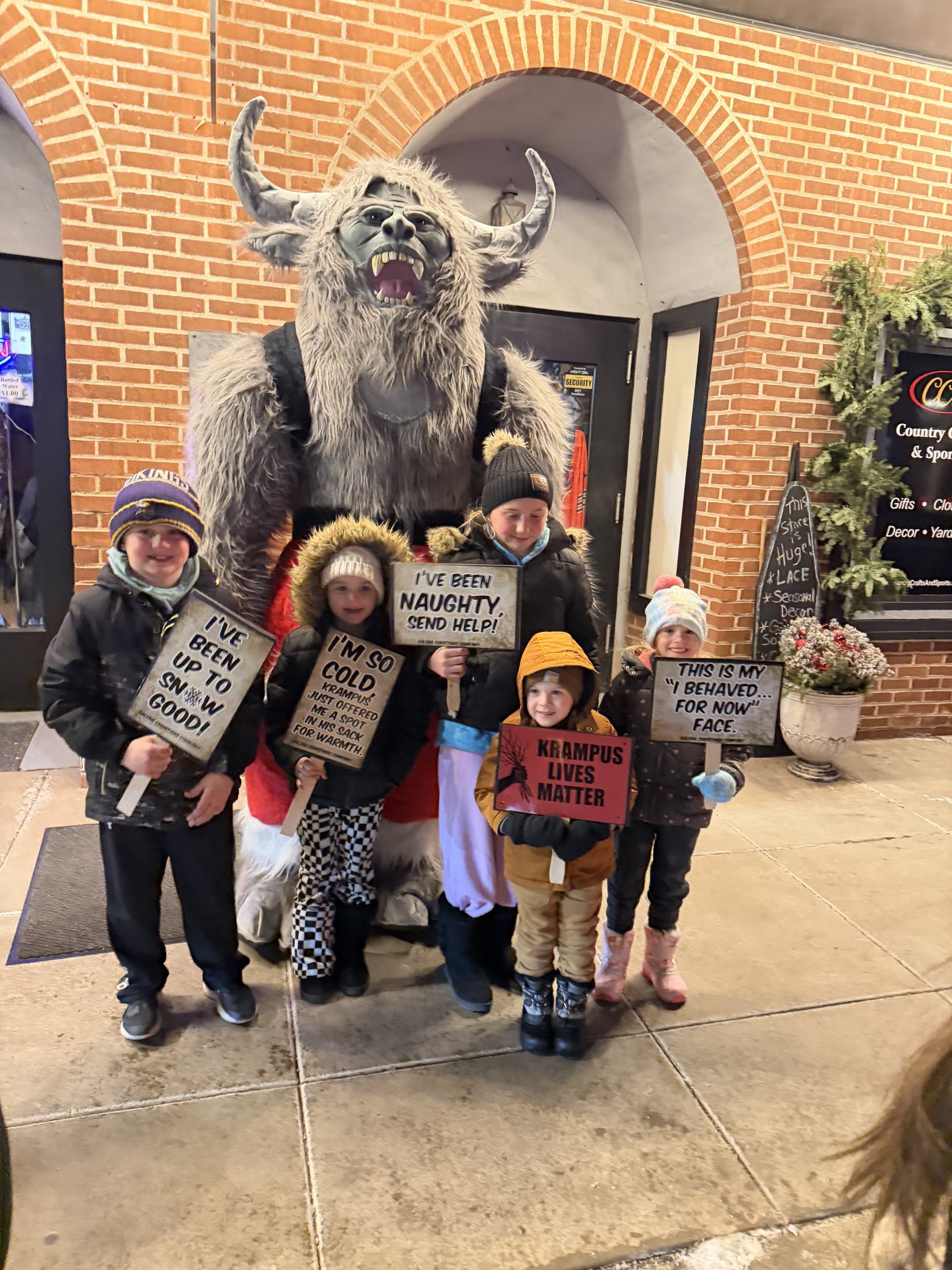 Krampy with visitors at Country Crafts & Sports during Galena’s Night of Luminaria and Living Windows, photo 7
