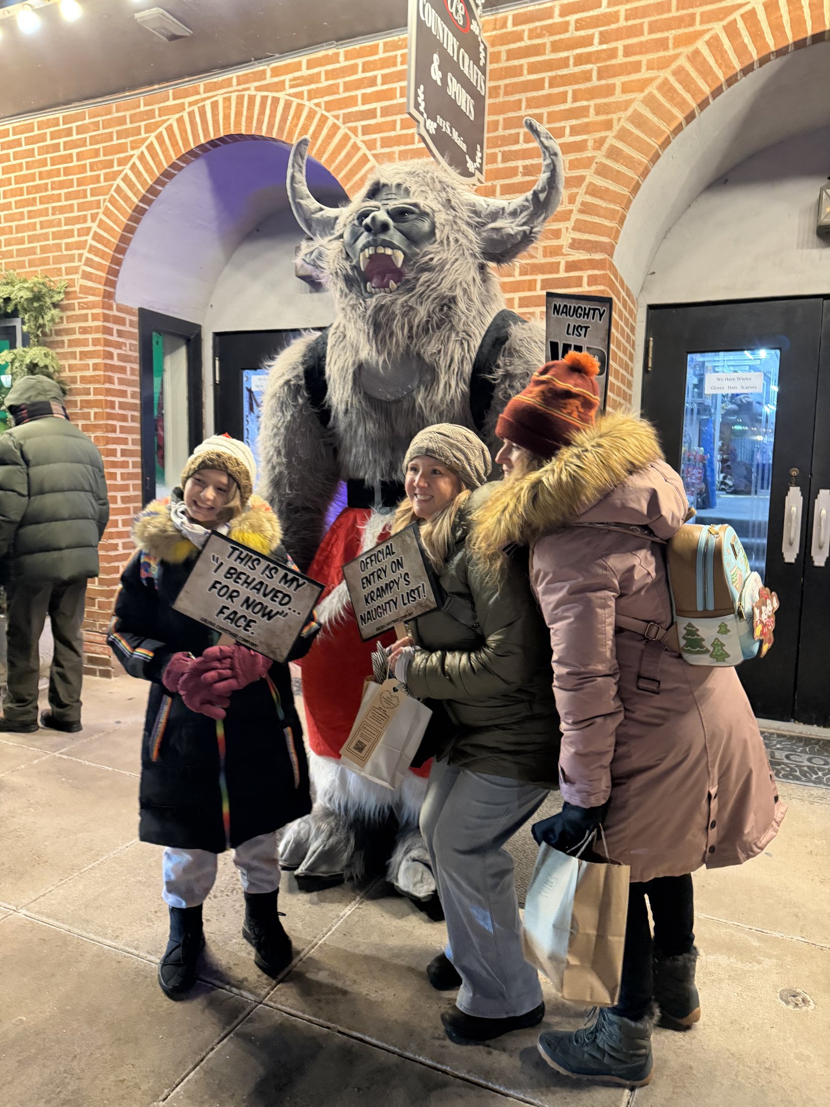 Krampy with visitors at Country Crafts & Sports during Galena’s Night of Luminaria and Living Windows, photo 8