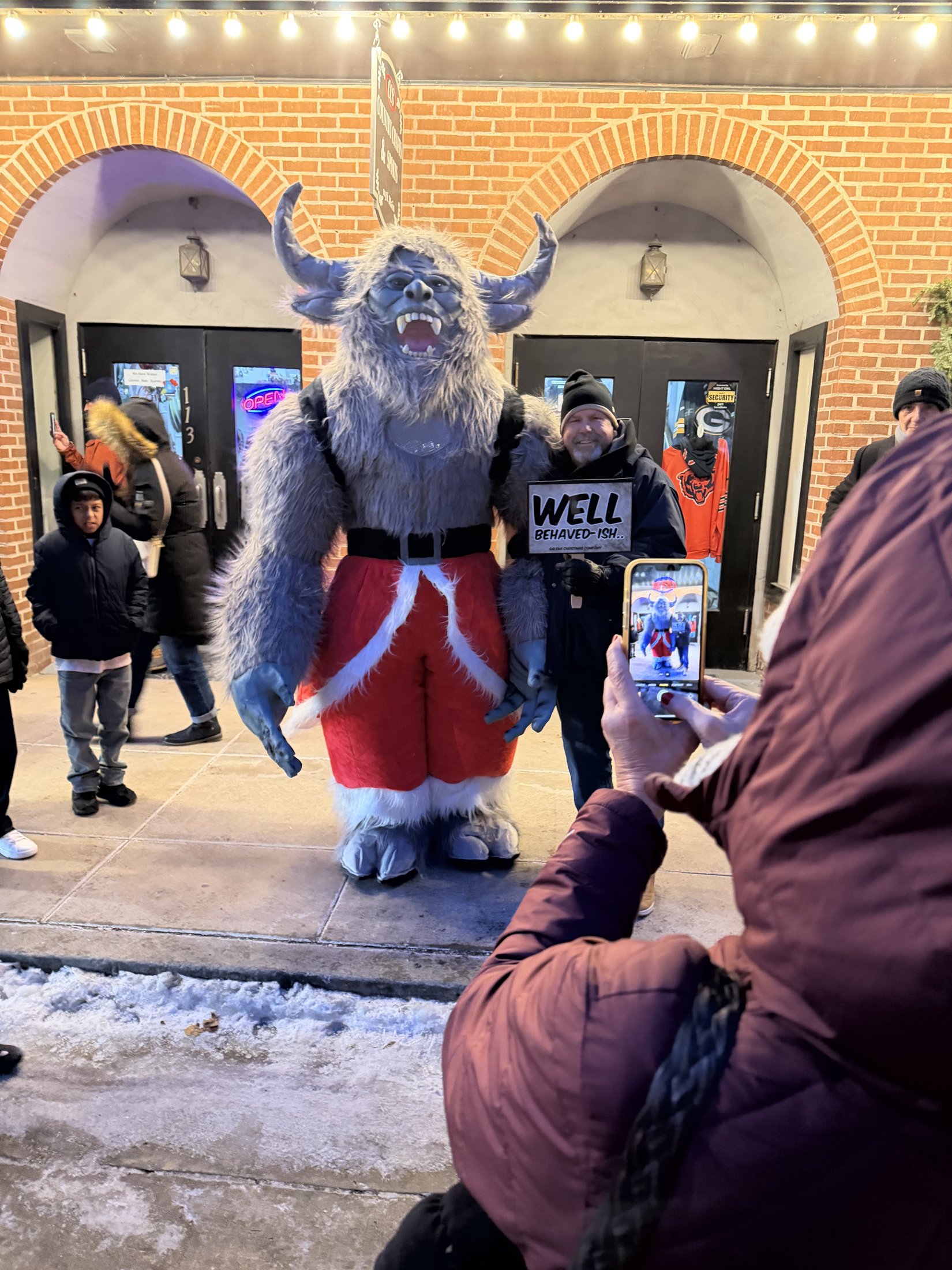 Krampy with visitors at Country Crafts & Sports during Galena’s Night of Luminaria and Living Windows, photo 12