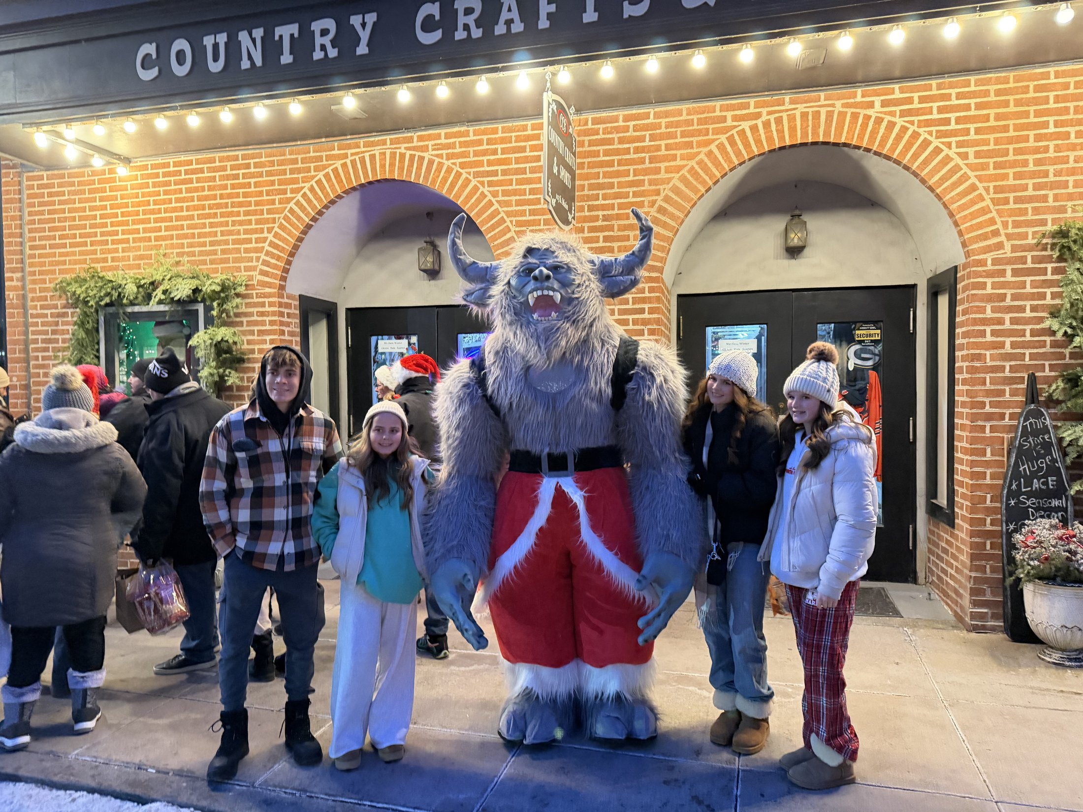 Krampy with visitors at Country Crafts & Sports during Galena’s Night of Luminaria and Living Windows, photo 13