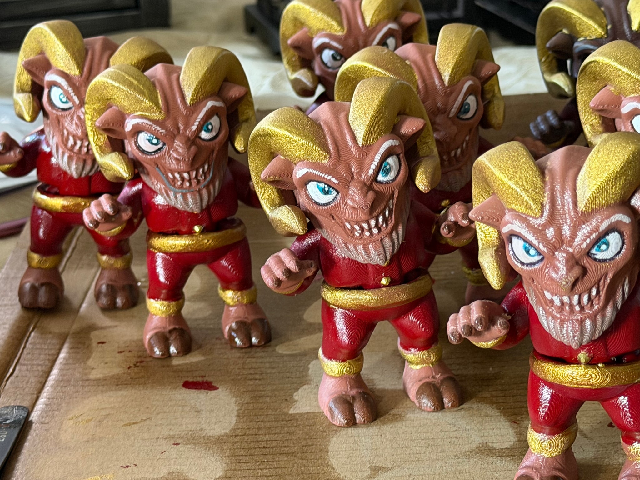 Hand-painted festive character figures in the workshop