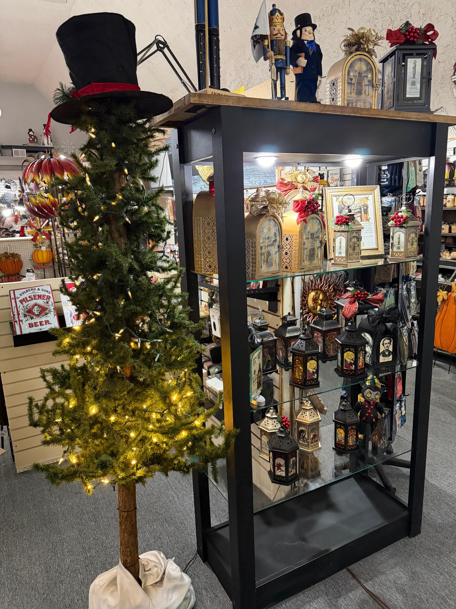 Seasonal Galena Christmas Company display with a decorated tree and lanterns