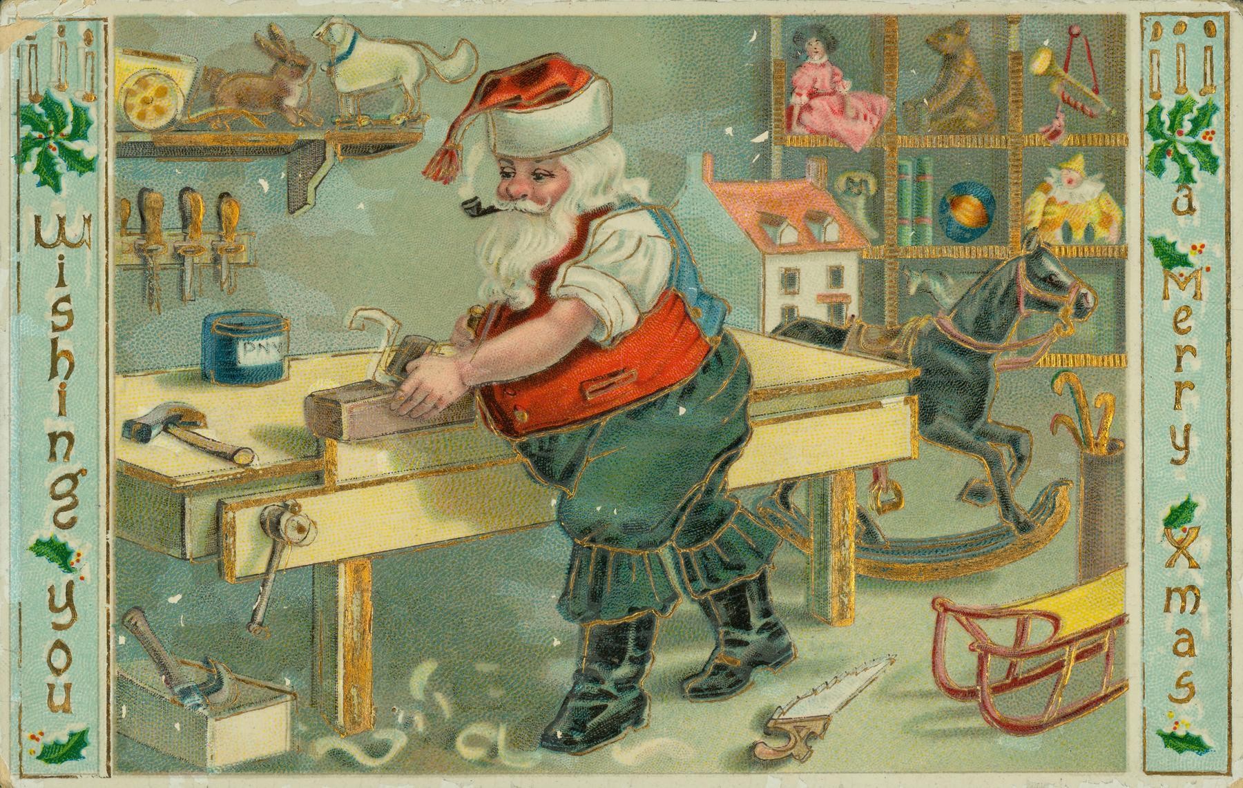 Santa Claus making toys in his workshop on a circa-1909 Christmas postcard