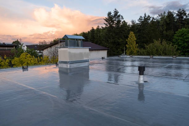 Reflective commercial roof coating at sunset