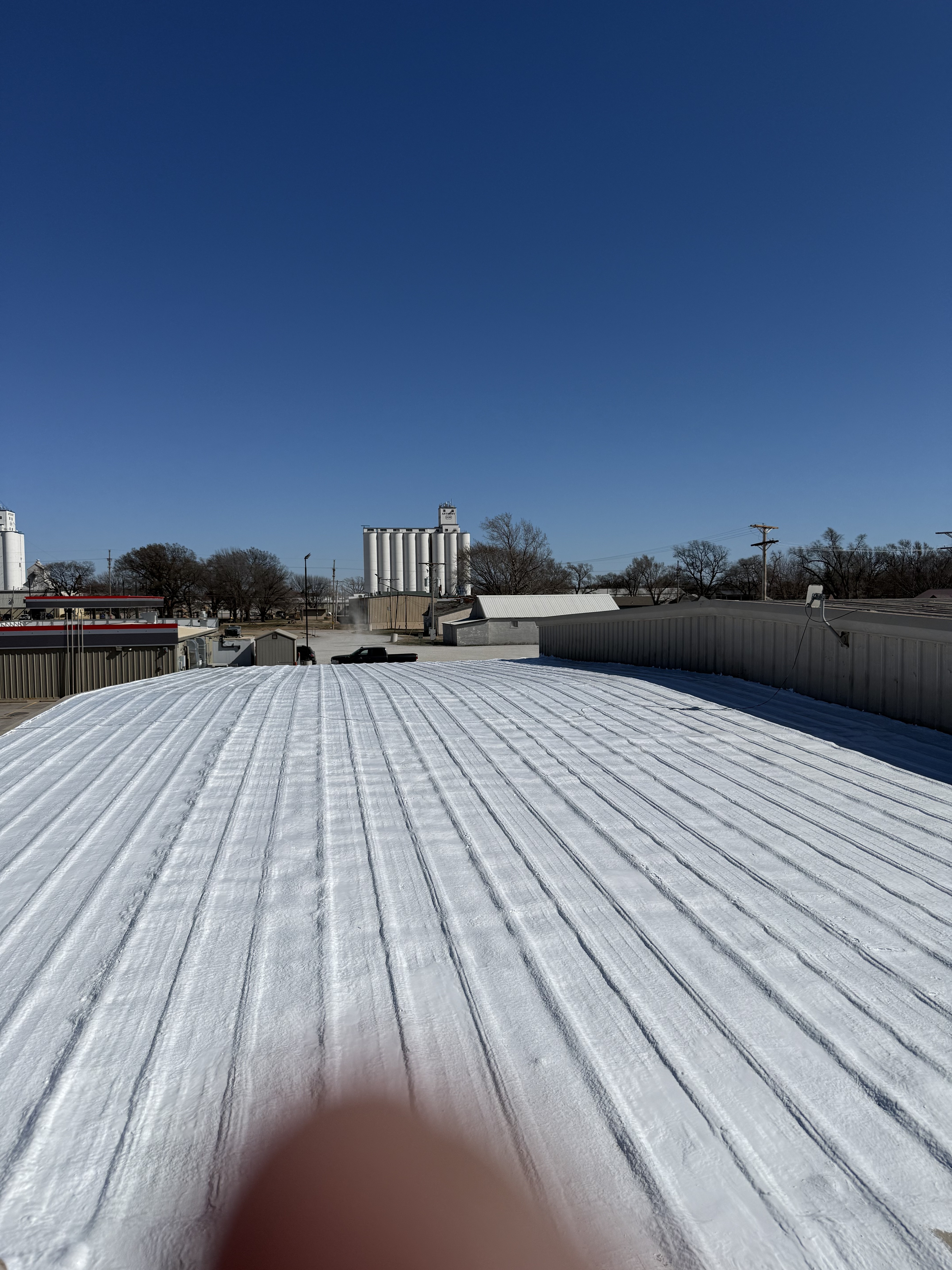 Commercial metal roof prepared for restoration coating