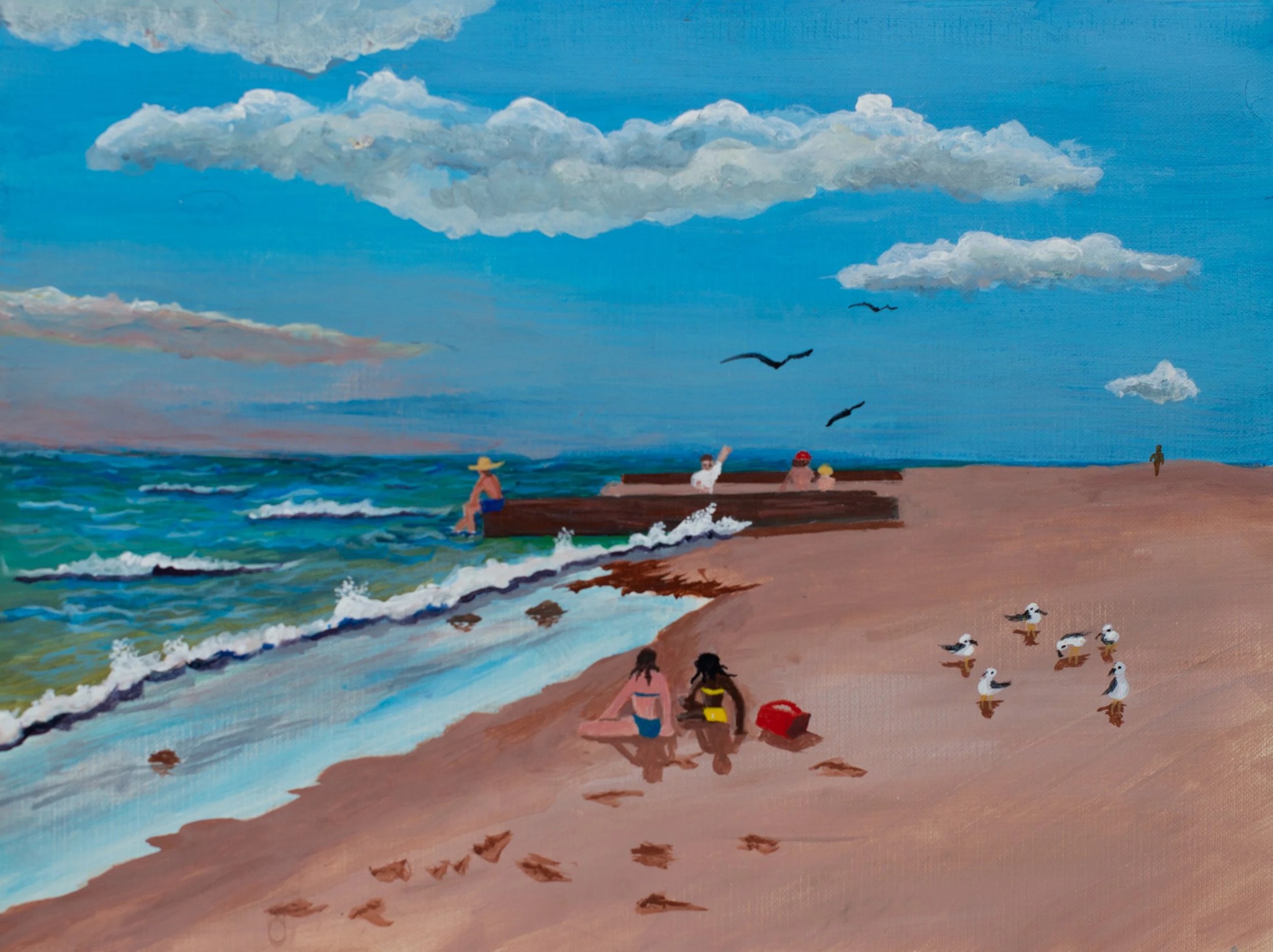 Beach scene with people sitting and walking, seagulls flying, and waves crashing on shore under a cloudy sky.